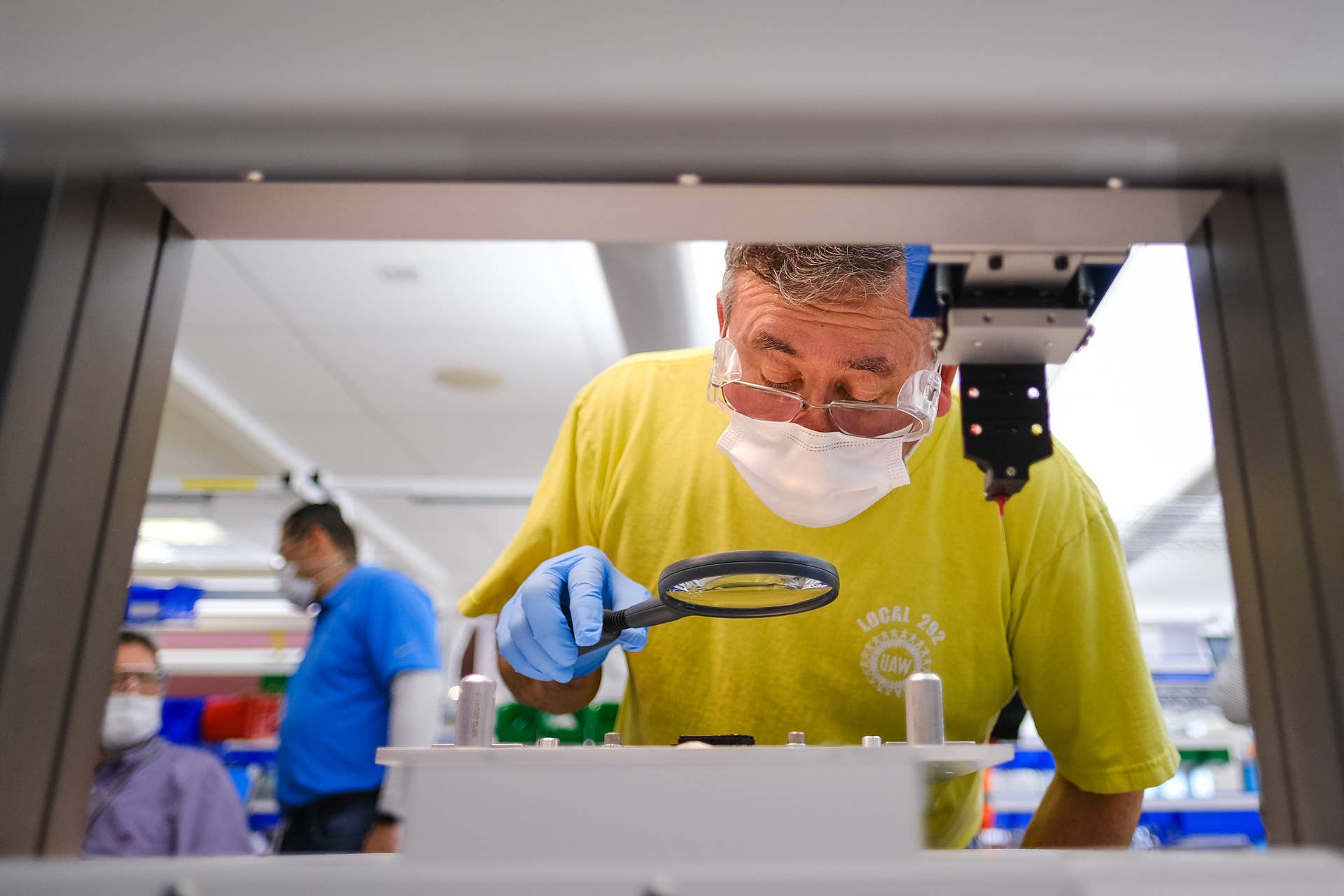Workers prepare to build ventilators at the GM manufacturing facility in Kokomo, Indiana, Tuesday, April 7, 2020, where GM and Ventec Life Systems are partnering to produce Ventec critical care ventilators in response to the COVID-19 pandemic. (Photo by AJ Mast for General Motors)