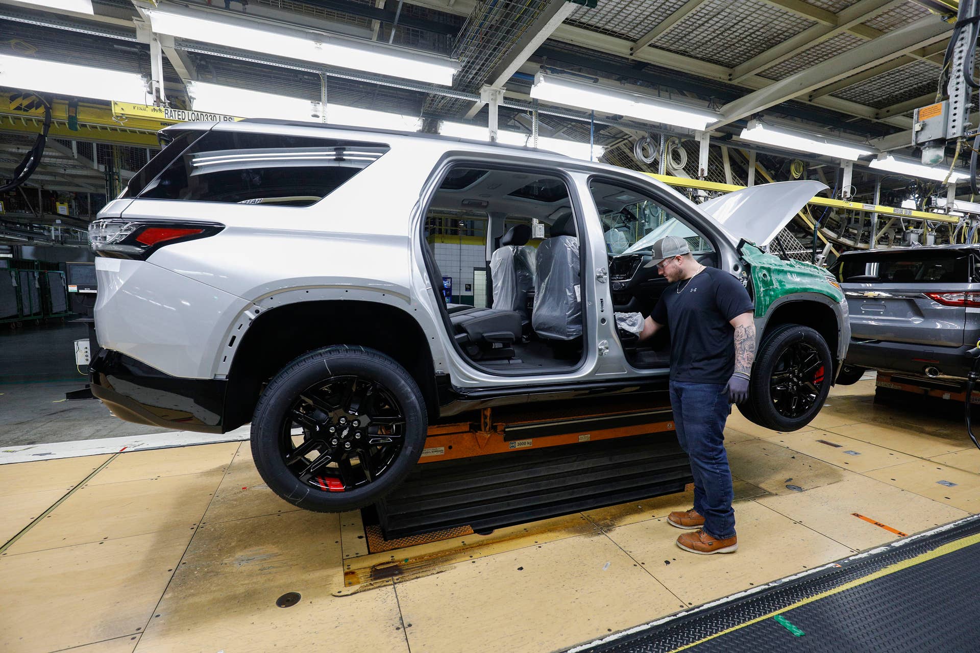 LANSING, MI - FEBRUARY 21: A General Motors worker is shown on the assembly line at the General Motors Lansing Delta Township Assembly Plant on February 21, 2020 in Lansing, Michigan. The plant, which employs over 2,500 workers, is home to the Chevrolet Traverse and Buick Enclave. Today at the plant the three millionth vehicle made at the plant, a Chevrolet Traverse Redline Edition rolled off the line. (Photo by Bill Pugliano/Getty Images)