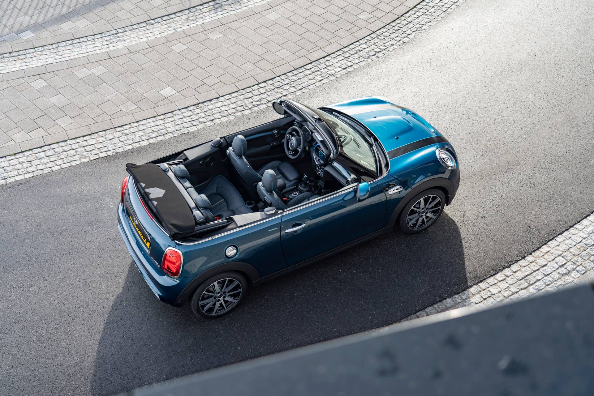 Resurrecting a name for an appearance package from 2007, the Mini Convertible Sidewalk pairs exclusive Deep Laguna Metallic with special wheels and Mini Yours interior options.