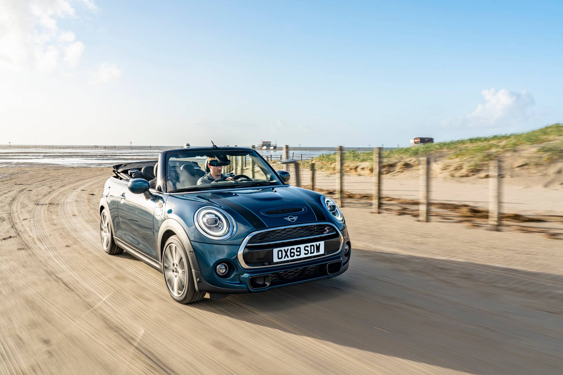 Resurrecting a name for an appearance package from 2007, the Mini Convertible Sidewalk pairs exclusive Deep Laguna Metallic with special wheels and Mini Yours interior options.
