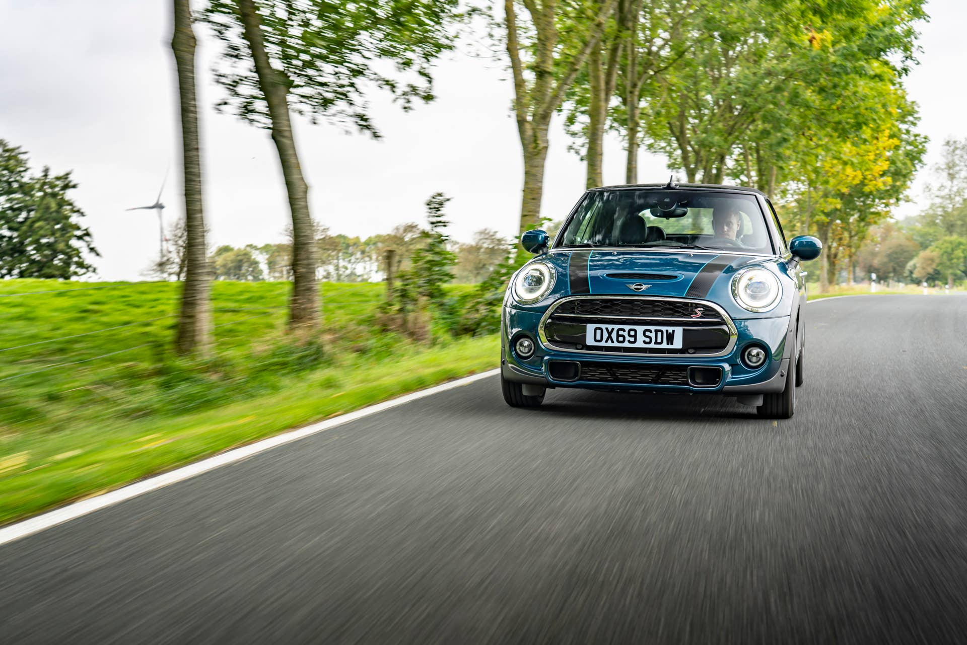 Resurrecting a name for an appearance package from 2007, the Mini Convertible Sidewalk pairs exclusive Deep Laguna Metallic with special wheels and Mini Yours interior options.
