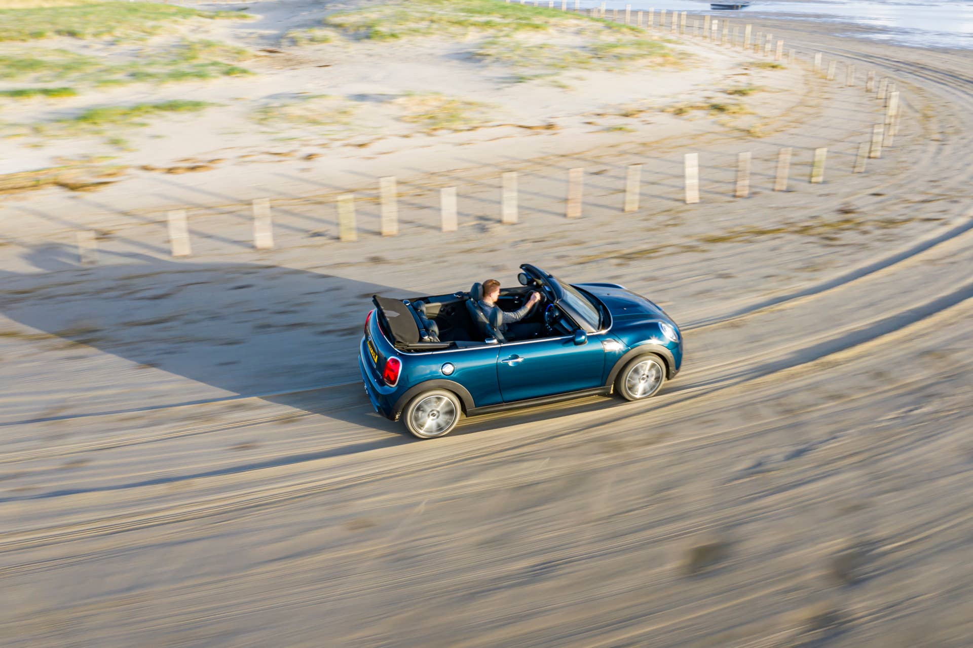 Resurrecting a name for an appearance package from 2007, the Mini Convertible Sidewalk pairs exclusive Deep Laguna Metallic with special wheels and Mini Yours interior options.