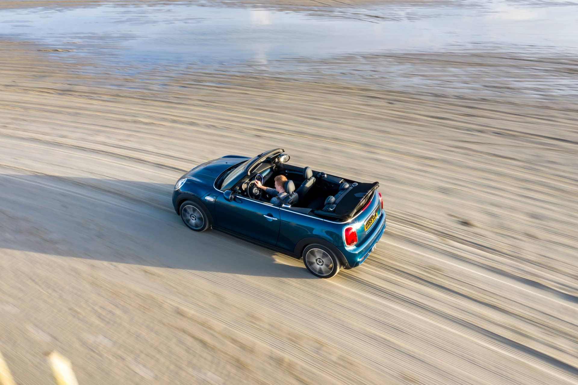 Resurrecting a name for an appearance package from 2007, the Mini Convertible Sidewalk pairs exclusive Deep Laguna Metallic with special wheels and Mini Yours interior options.