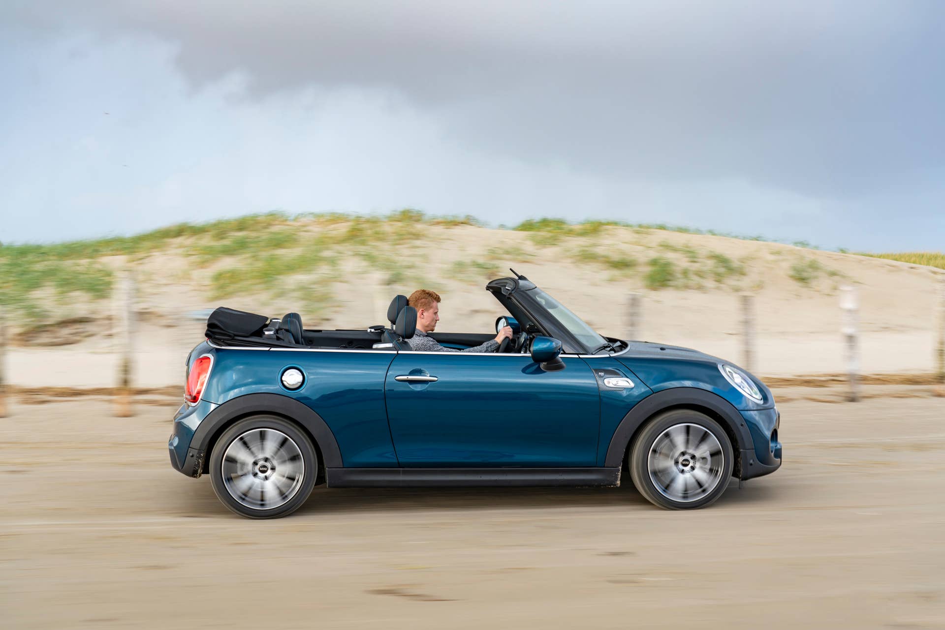 Resurrecting a name for an appearance package from 2007, the Mini Convertible Sidewalk pairs exclusive Deep Laguna Metallic with special wheels and Mini Yours interior options.