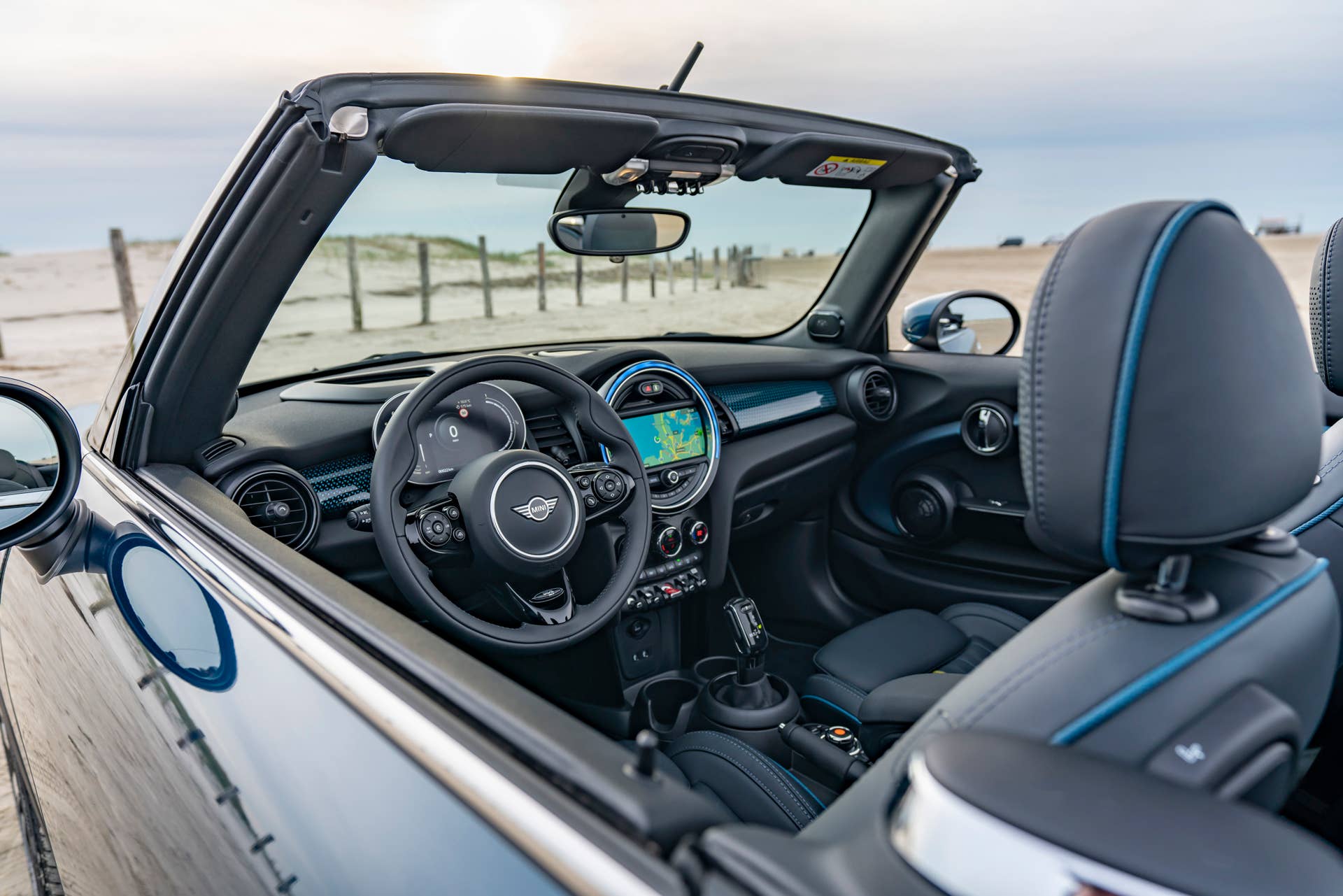 Resurrecting a name for an appearance package from 2007, the Mini Convertible Sidewalk pairs exclusive Deep Laguna Metallic with special wheels and Mini Yours interior options.