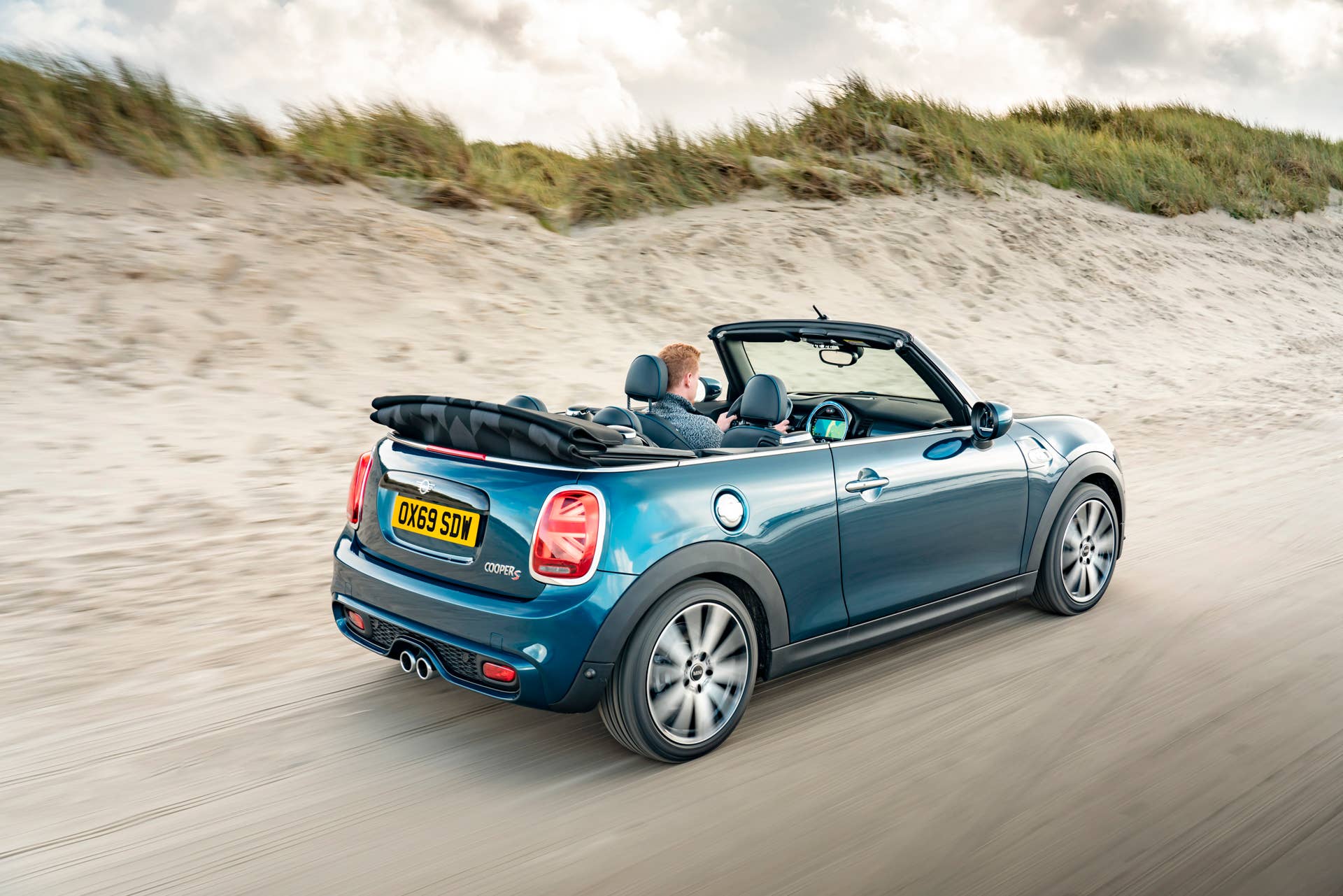 Resurrecting a name for an appearance package from 2007, the Mini Convertible Sidewalk pairs exclusive Deep Laguna Metallic with special wheels and Mini Yours interior options.