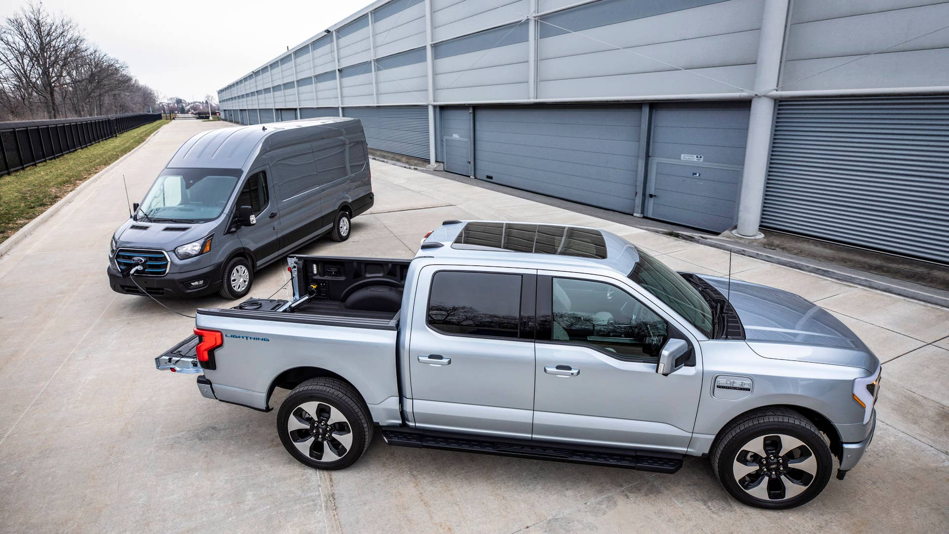 Aftermarket equipment shown. Ford E-Transit available early 2022. Preproduction Ford F-150 Lightning with optional equipment shown. Available starting spring 2022