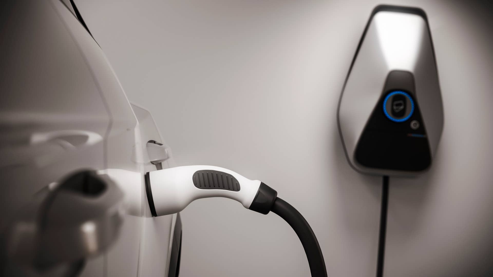 charging generic electric car in garage close up 3d rendering