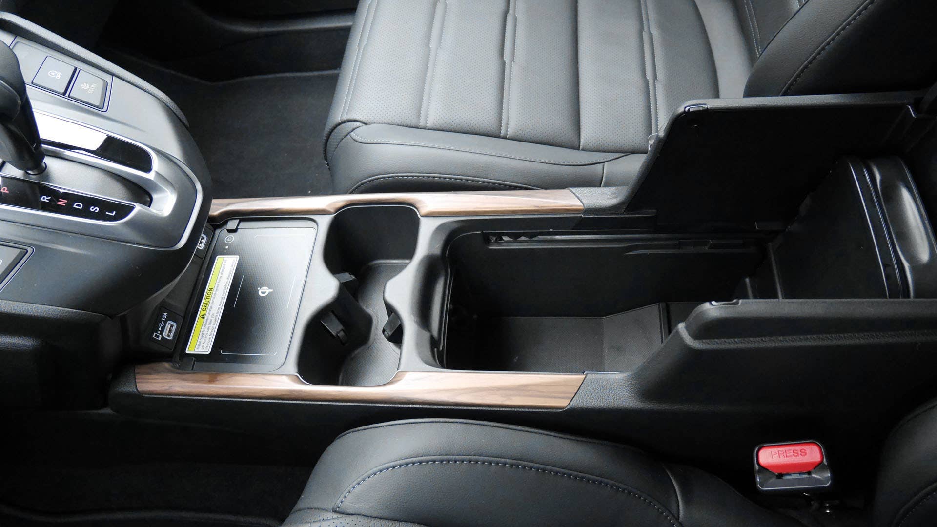 Many-ways adjustable center console bin
