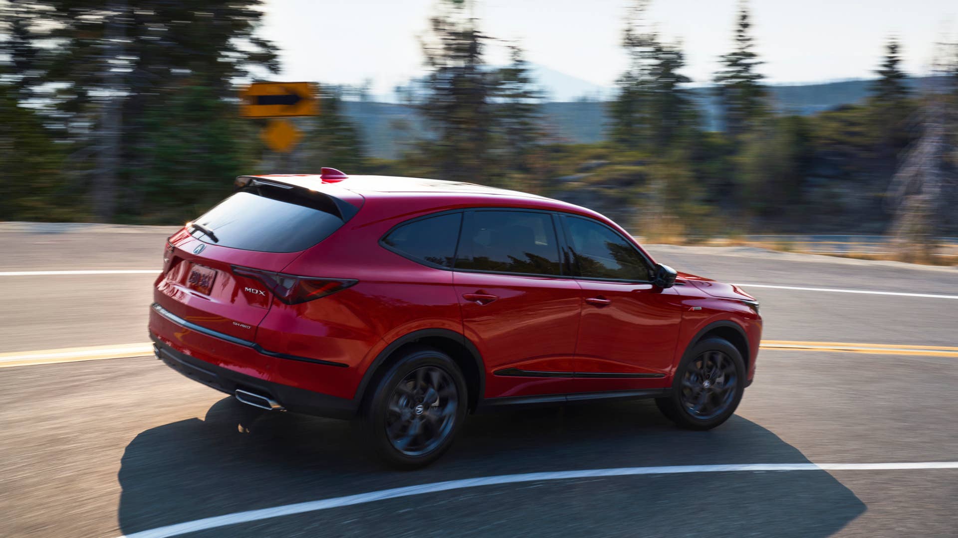 2022 MDX SH-AWD A-Spec Performance Red Pearl 3/4 Front Driver Exterior running back road