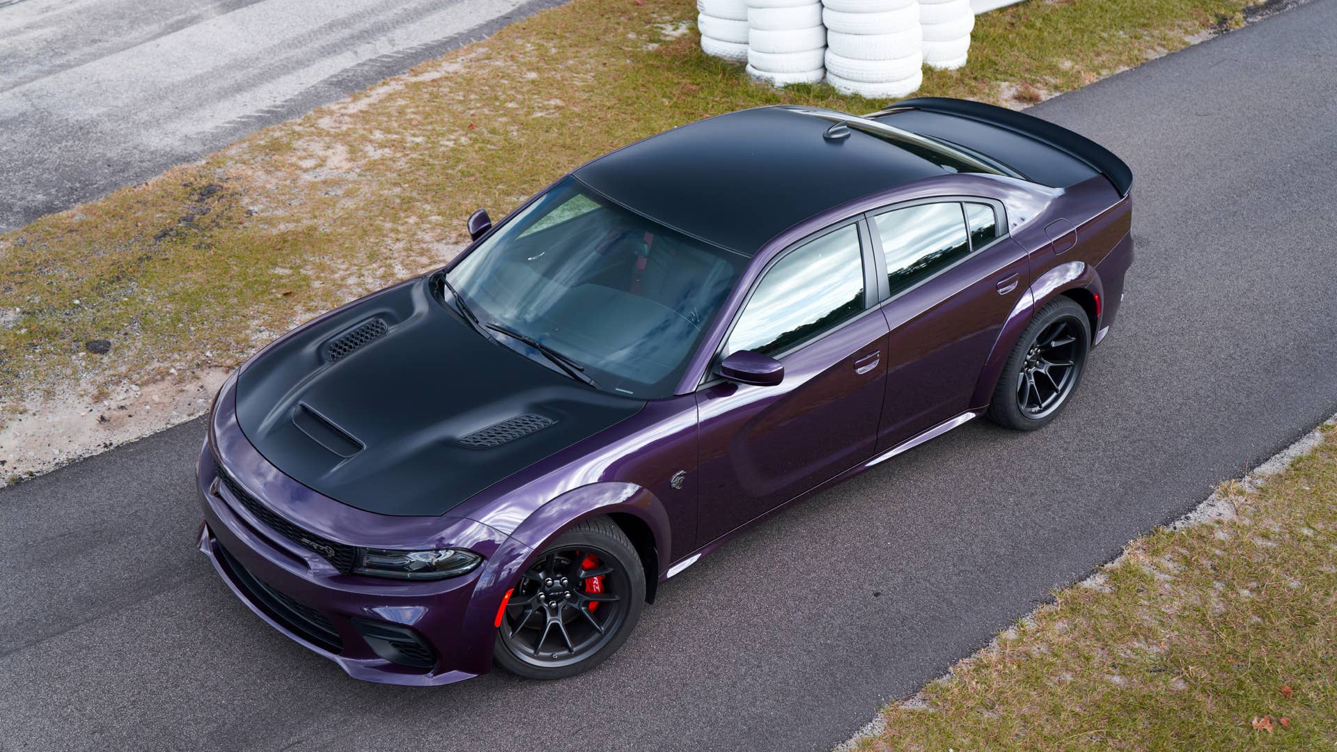 2021 Dodge Charger SRT Hellcat Redeye: Beyond its menacing stance, the newly designed performance hood on the Charger SRT Hellcat Redeye looks even more sinister and provides maximum air intake to the supercharged power plant from the functional hood scoop to boost power.