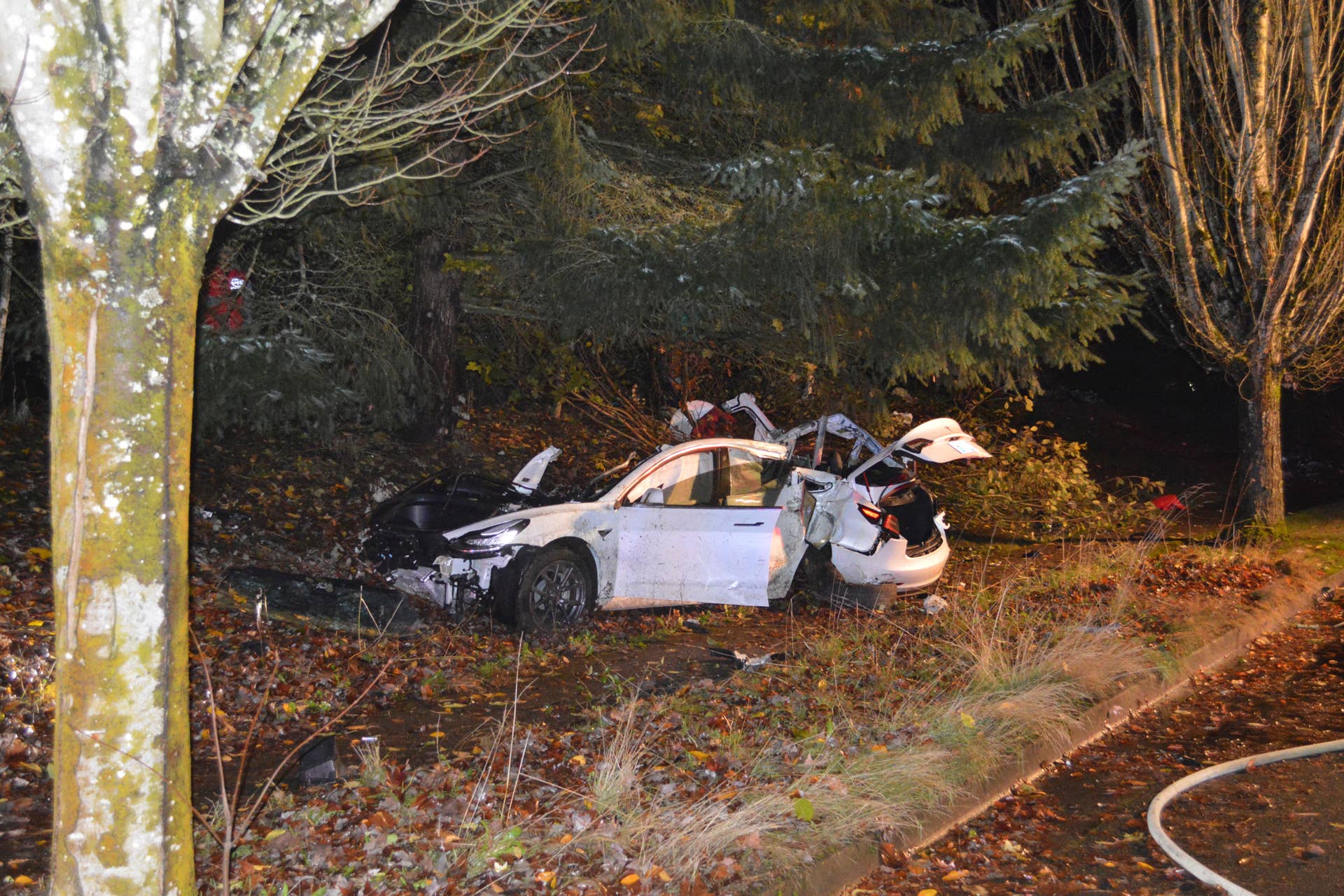 FILE - In this Nov. 17, 2020, file photo provided by the Corvallis Police Department is the scene where an Oregon man crashed a Tesla while going about 100 mph, destroying the vehicle, a power pole and starting a fire when some of the hundreds of batteries from the vehicle broke windows and landed in residences in Corvallis, Ore. Dylan Milota, who survived the crash, was driving the 2019 Tesla S when he lost control. Pandemic lockdowns and stay-at-home orders kept many drivers off U.S. roads and highways in 2020. But those who did venture out found open lanes that only invited reckless driving, leading to a sharp increase in traffic-crash deaths across the country. (Corvallis Police Department via AP, File)