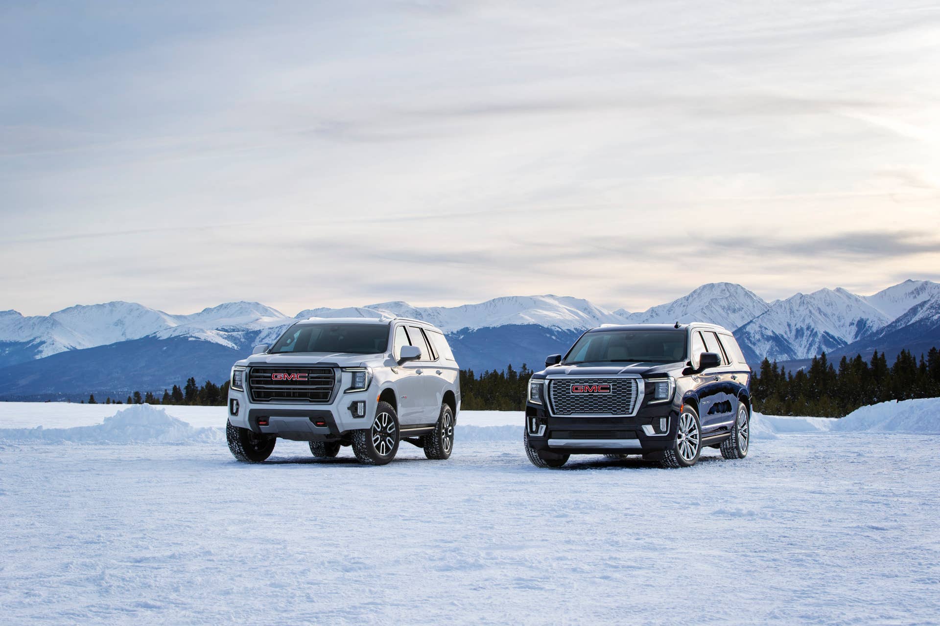 (L to R) 2021 GMC Yukon AT4 and Denali