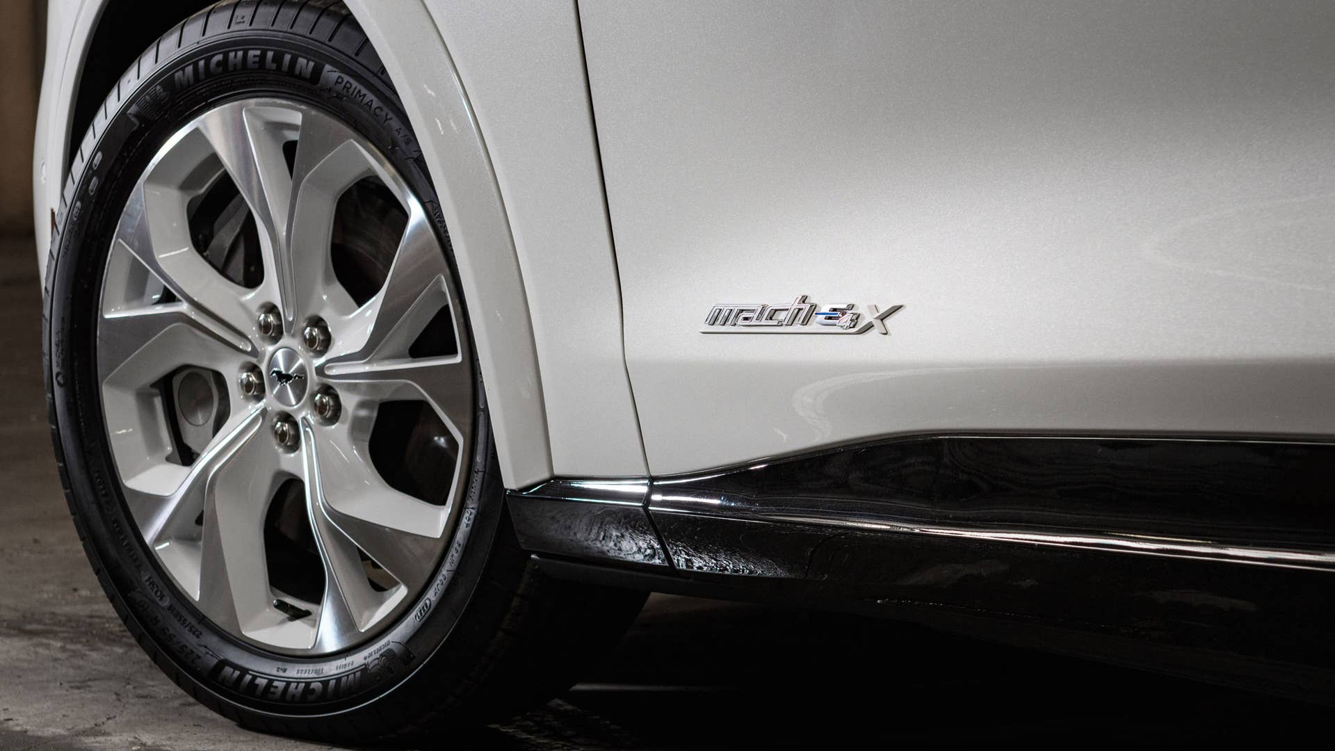 Available Ice White Appearance Package on appropriately configured 2022 Mustang Mach-E and Mustang Coupe models. Closed course.