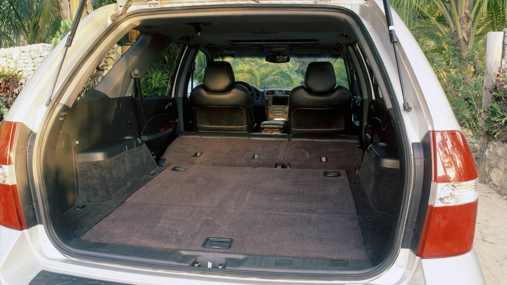 The interior of the MDX hosts a long list of standard features, and is uniquely transformable, capable of accommodating up to seven passengers.  Second- and third-row seats that split and fold flat into the floor make for an interior that can be quickly and easy reconfigured to accommodate from one to seven passengers and a wide variety of cargo, from gardening to recreation and sports equipment, including a six foot ladder.  A wide track and flat floor design further enhance the vehicle’s passenger and cargo carrying capabilities. The optional Acura Navigation System with DVD (digital versatile disc) contains mapping of the continental U.S. on a single disc and features a nationwide directory of 3.7-million points of interest, restaurants, hotels, ATMs and a number of other categories.  In addition, the system offers a unique line trace function that leaves “electronic bread crumbs” on the navigation screen for re-tracing your steps during off-road excursions in unmapped areas.