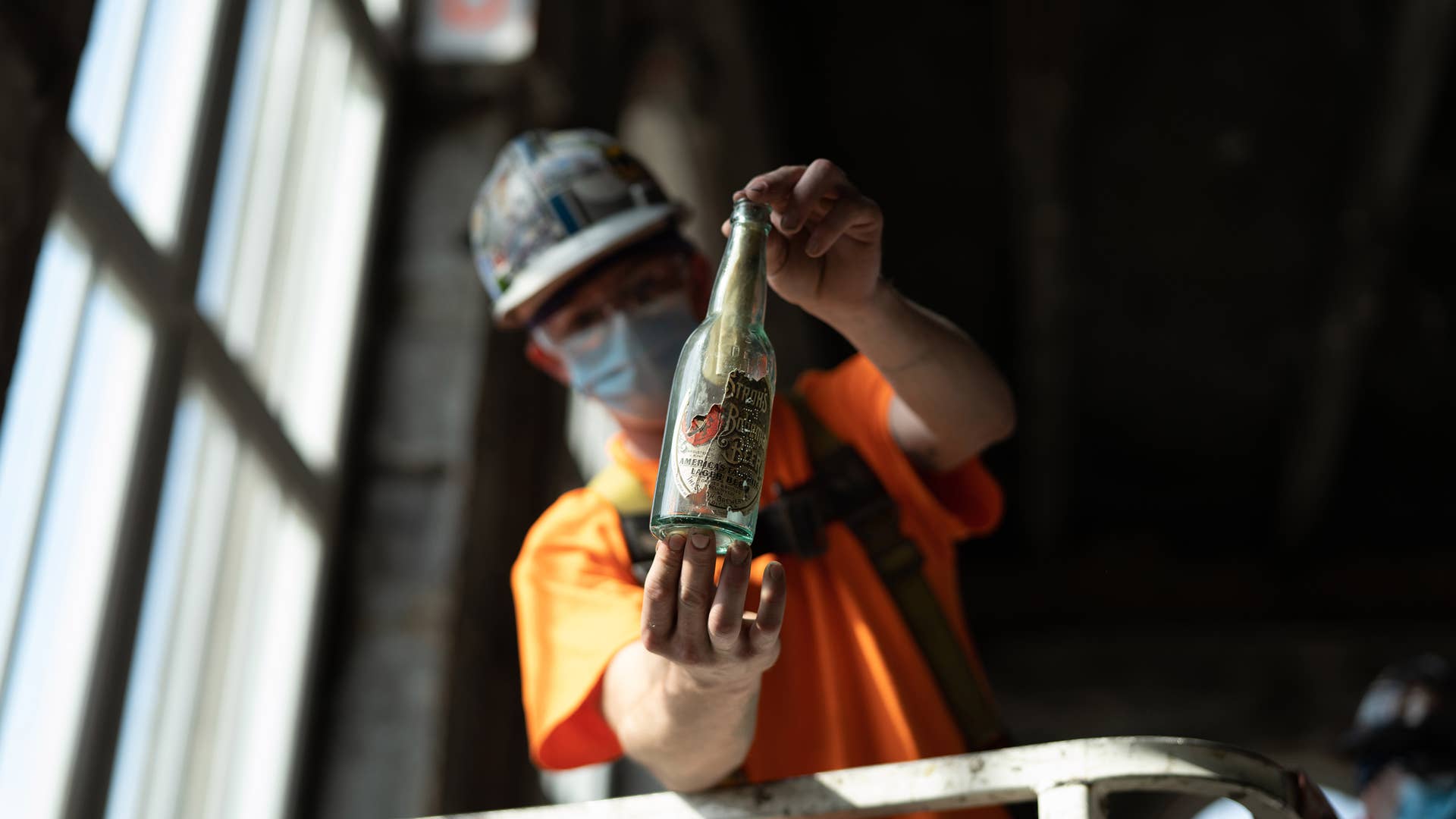 Crews working at Michigan Central Station recently stumbled upon a pre-Prohibition-era Stroh’s beer bottle with a mysterious message neatly rolled and stuffed inside. Ford archivists removed the paper Thursday to reveal a message that is believed to have been written by two men who worked on the station’s original construction in 1913, though the entirety of the message is unclear.