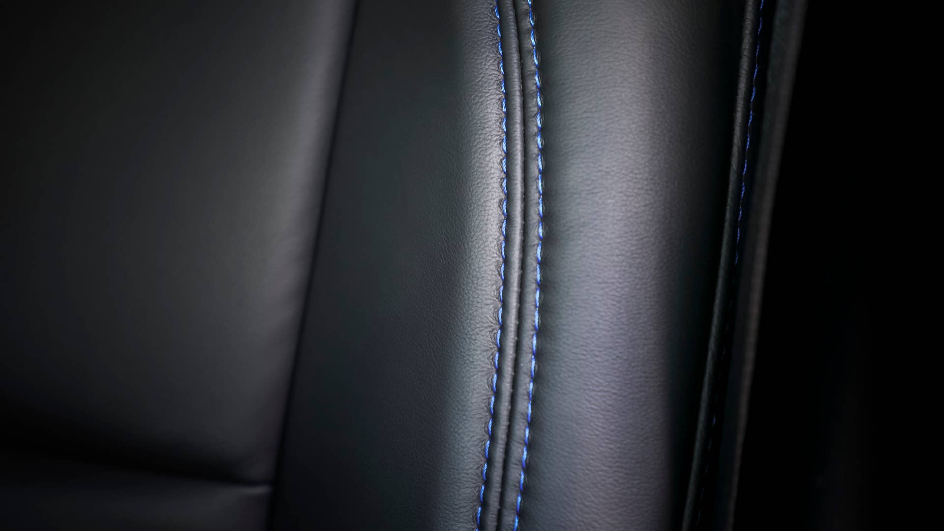 Inside the cabin of the Jeep Gladiator Top Dog Concept, black Katzkin leather seats are accented with blue stitching.