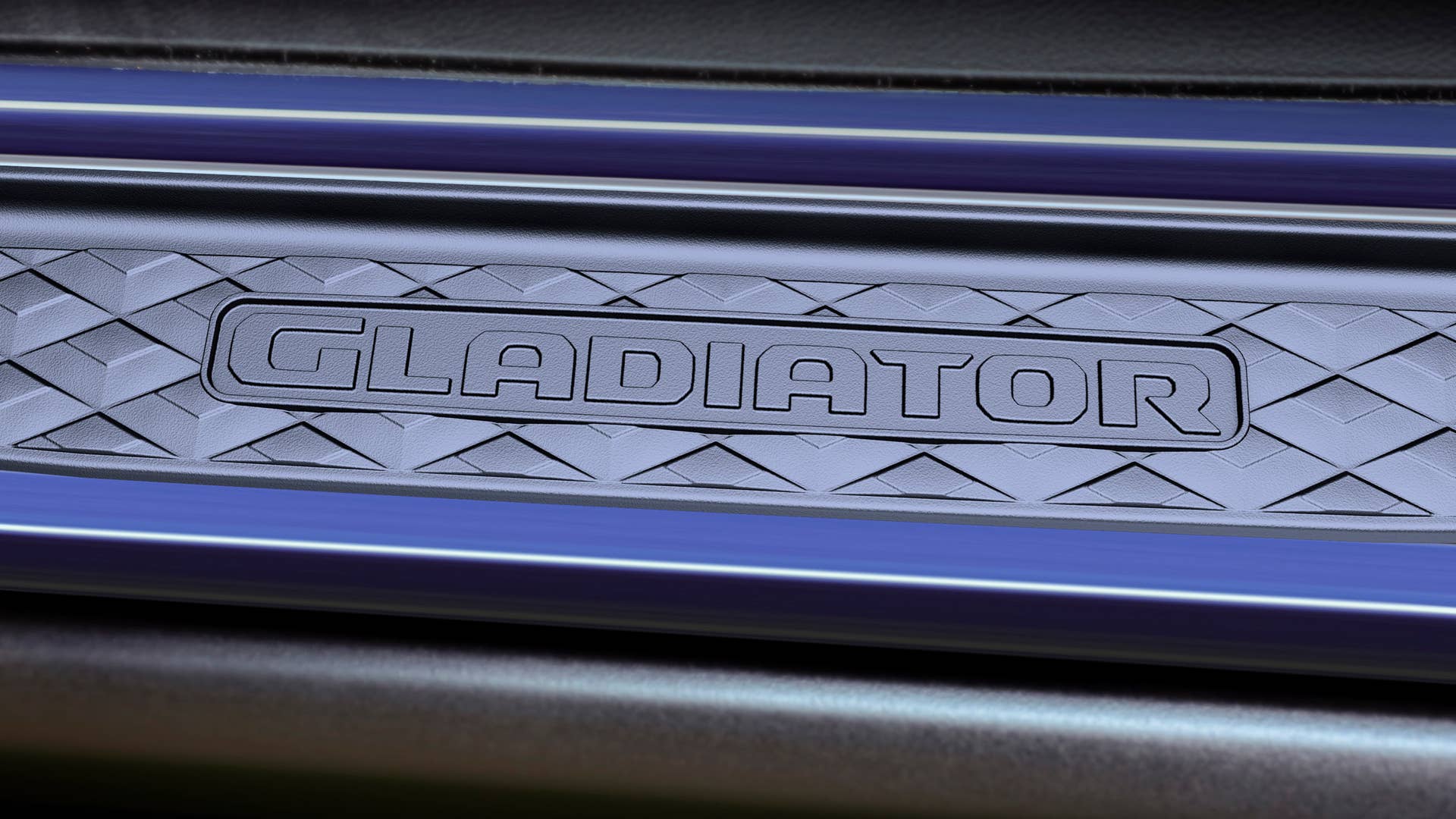 Black door-sill guards feature a raised Gladiator logo and help protect the interior sills of the Jeep Top Dog Concept from scratches and scuffs.