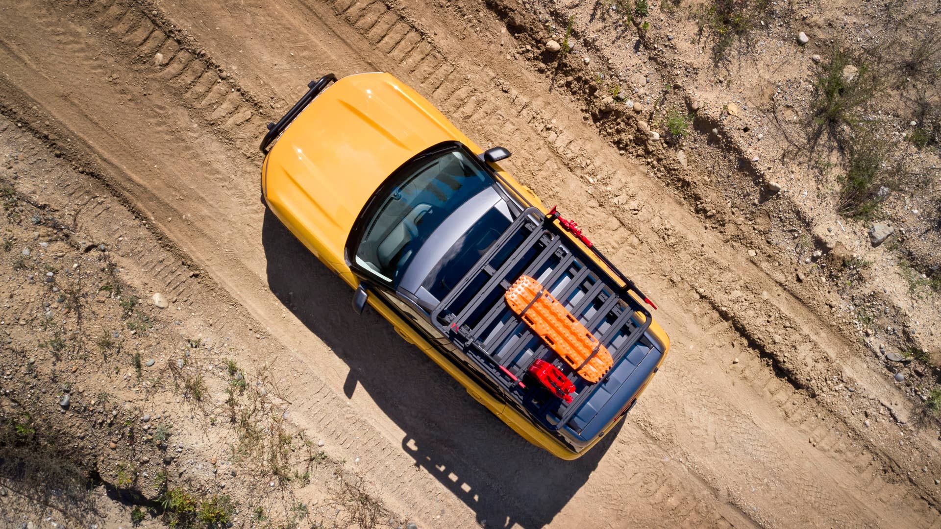 Bronco Sport Trail Rig. For adventurers looking to elevate their off-road trekking in a small, rugged 4x4, the Bronco Sport Trail Rig amps up the Badlands series model by adding 31-inch BFGoodrich™ Mud-Terrain T/A® KM3 tires, a one-inch lift kit, plus Ford Performance by RIGID LED off-road lights mounted to a front nudge bar. On top, a Yakima LockNLoad Platform roof rack and off-road gear mounts are designed to carry gear like a high-lift jack kit, Ford Performance recovery boards and jerry cans. (Preproduction image with optional features shown. Available late 2020.)