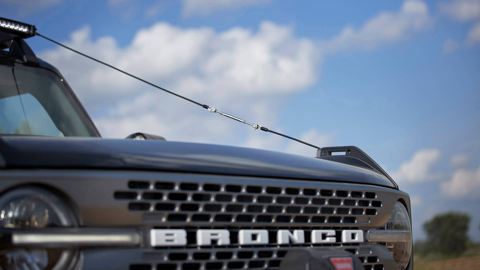 Bronco Two-Door Trail Rig. Designed to be the ultimate hardcore trail rider, this custom build is based on the two-door Badlands™ series. It begins with a Ford Performance modular front bumper, tube doors, beadlock-capable wheels  and 40-inch RIGID® LED lightbar. A Ford Performance by WARN® winch helps rescue your lesser-equipped 4x4 friends. On top, factory roof rails are augmented with a Yakima Platform roof rack system with mounts for a shovel, and Ford Performance by WARN recovery kit and recovery boards. Inside are rugged floor mats and a rear swing-gate-mounted table. (Preproduction image with optional features shown. Available beginning Spring 2021.)