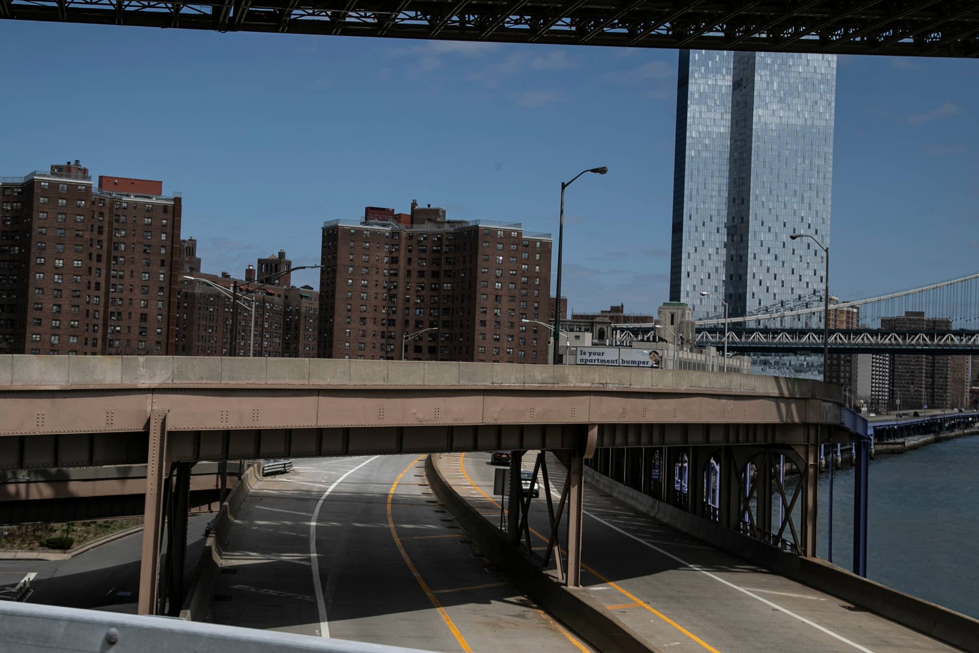 The Franklin D. Roosevelt East River Drive or FDR, a parkway on the east side of New York is seen with few vehicles, on Sunday, March 22, 2020. New York City's mayor prepared Sunday to order his city behind closed doors in an attempt to slow a pandemic that has swept across the globe and threatened to make the city of 8.5 million one of the world's biggest coronavirus hot spots. (AP Photo/Wong Maye-E)