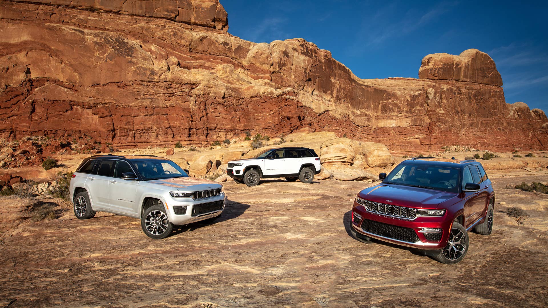All-new 2022 Jeep® Grand Cherokee (from left to right): Overland, Trailhawk and Summit Reserve