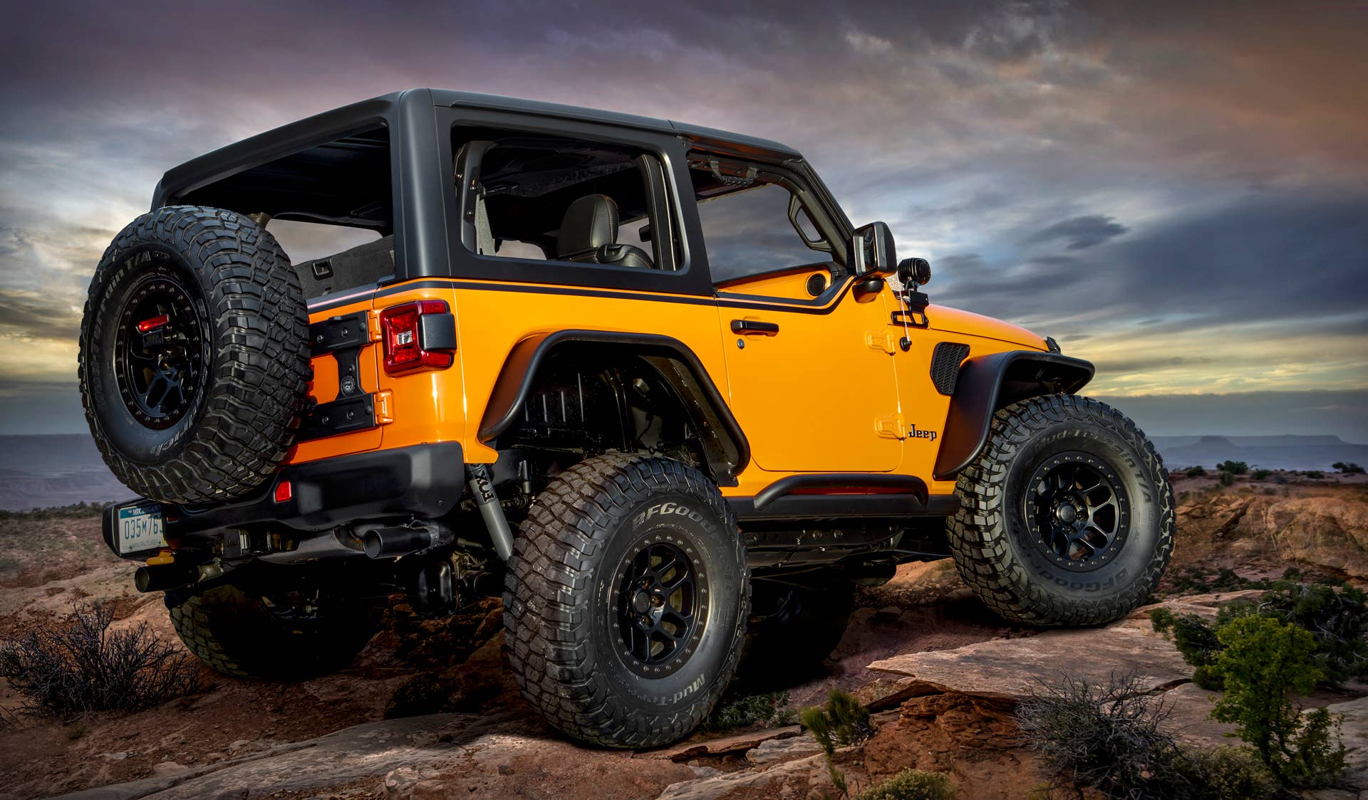 Based on a two-door Wrangler, the Jeep® Orange Peelz concept pays tribute to the long-standing, open-air, fun-and-freedom lifestyle that makes the Jeep Wrangler a global icon. Mopar designers have vastly enhanced the Wrangler’s open-air heritage by removing side and rear windows, installing prototype JPP half doors and a custom removable one-piece Freedom Top glass sunroof.
