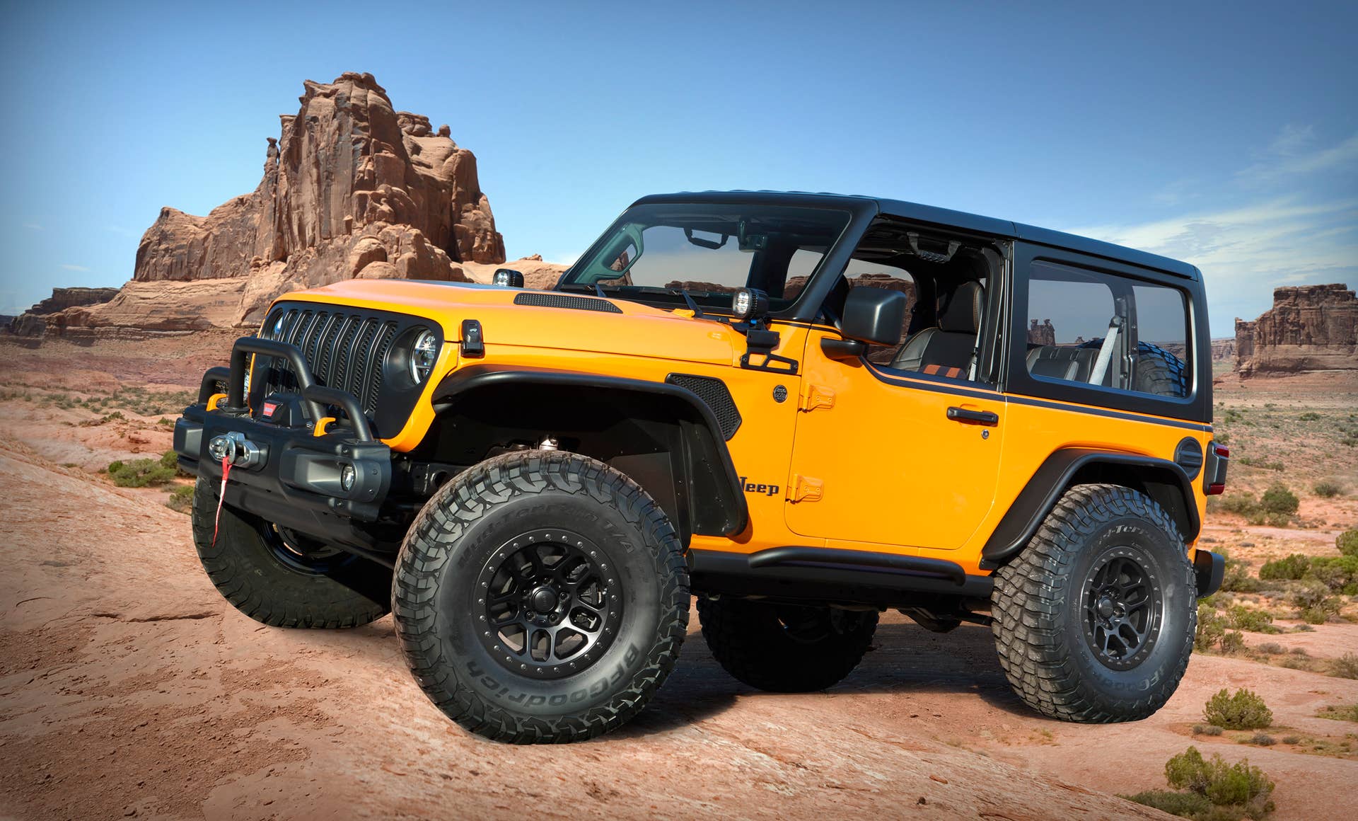 Based on a two-door Wrangler, the Jeep® Orange Peelz concept pays tribute to the long-standing, open-air, fun-and-freedom lifestyle that makes the Jeep Wrangler a global icon. Mopar designers have vastly enhanced the Wrangler’s open-air heritage by removing side and rear windows, installing prototype JPP half doors and a custom removable one-piece Freedom Top glass sunroof.