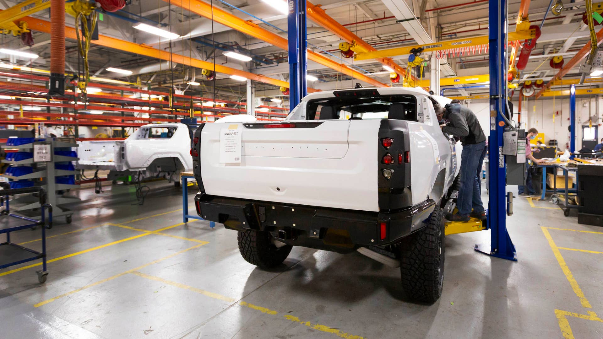 Two GMC HUMMER EVs completing their builds prior to shipping for continued validation testing. (Photo by Jeffrey Sauger for General Motors)