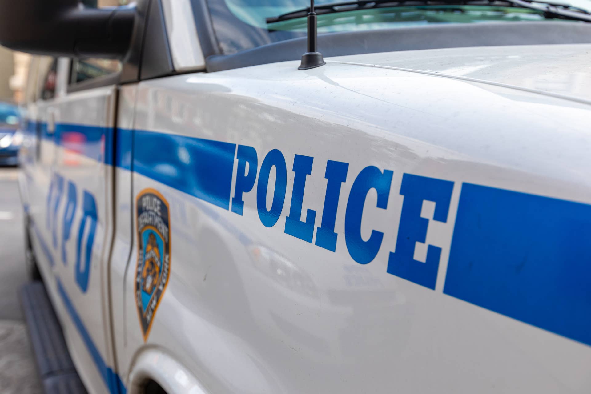 Police Vehicle in NYC, USA. Blue Color on the White Car.