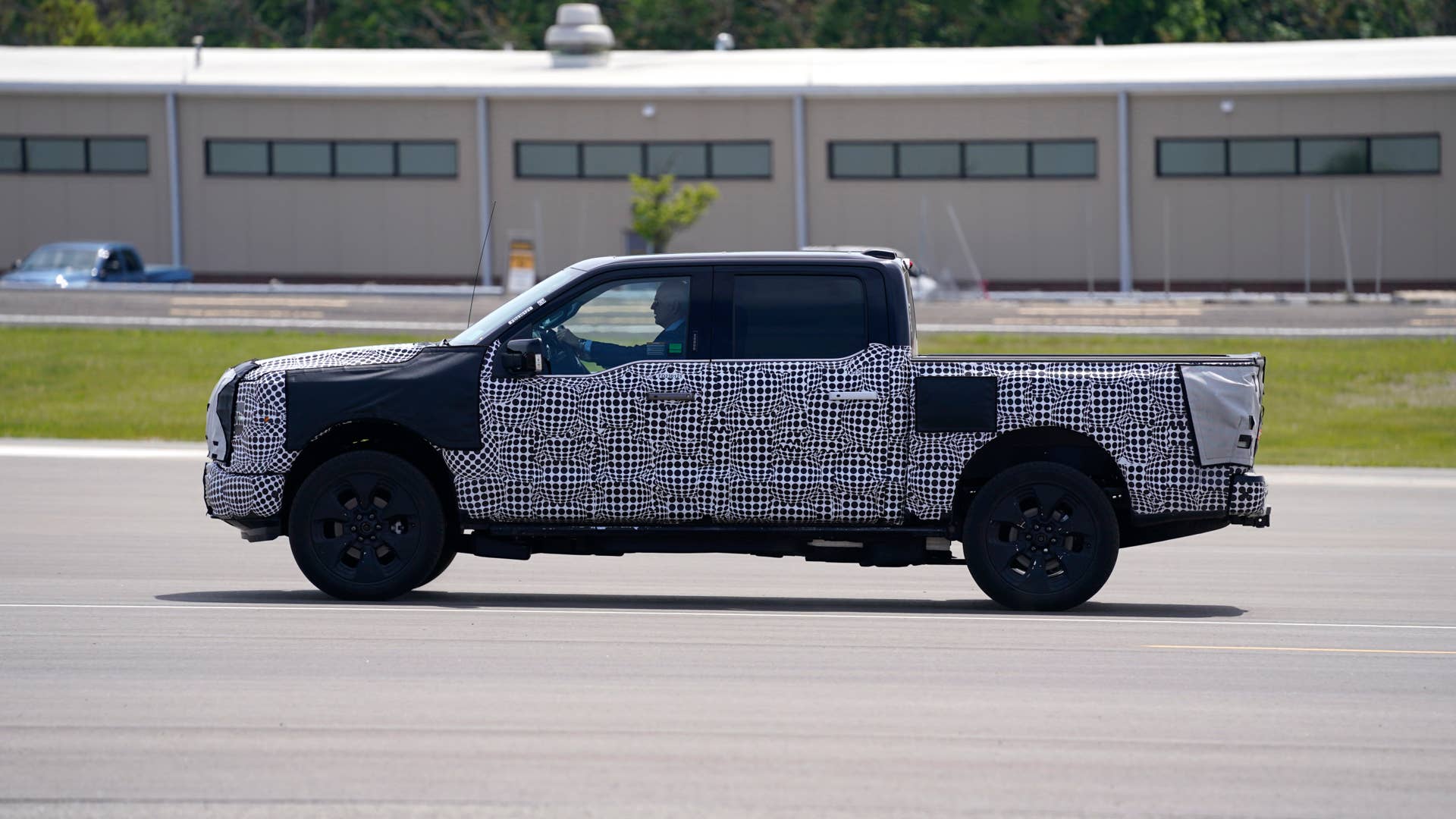 President Joe Biden drives a truck at Ford Dearborn Development Center, Tuesday, May 18, 2021, in Dearborn, Mich. (AP Photo/Evan Vucci)