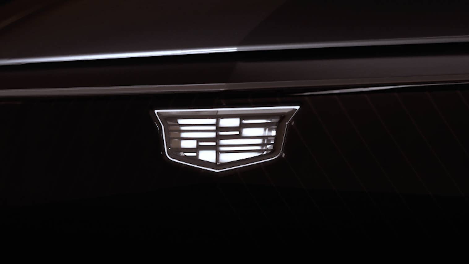 The Cadillac emblem illuminated on an electric car