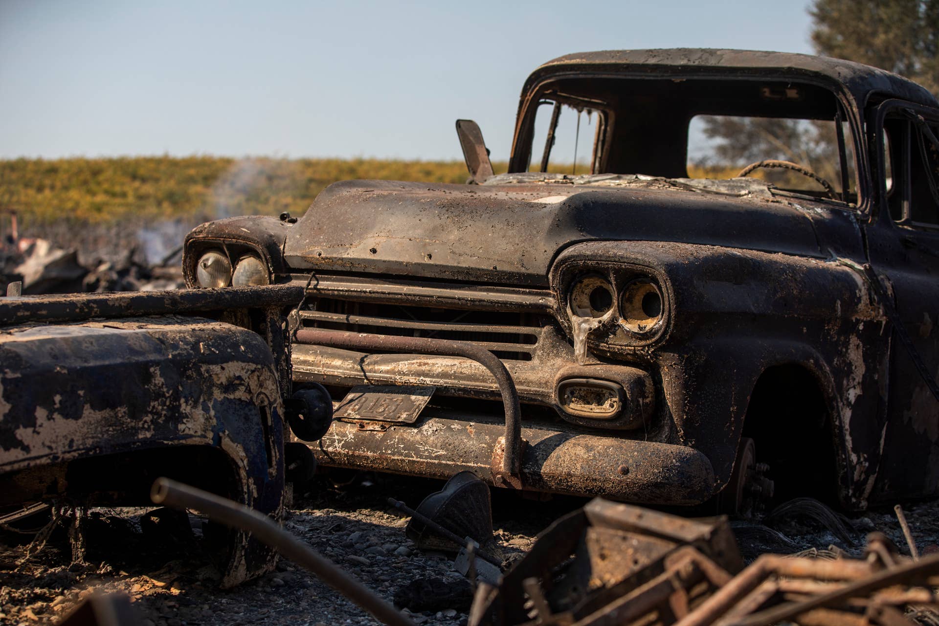 The charred remains of a classic truck sits on a property burned during the Kincade Fire, along Highway 128 at  in Healdsburg, California on October 28, 2019. - California's governor declared a state-wide emergency on October 27 as a huge wind-fueled blaze forced evacuations and massive power blackouts, threatening towns in the famed Sonoma wine region. (Photo by Philip Pacheco / AFP) (Photo by PHILIP PACHECO/AFP via Getty Images)