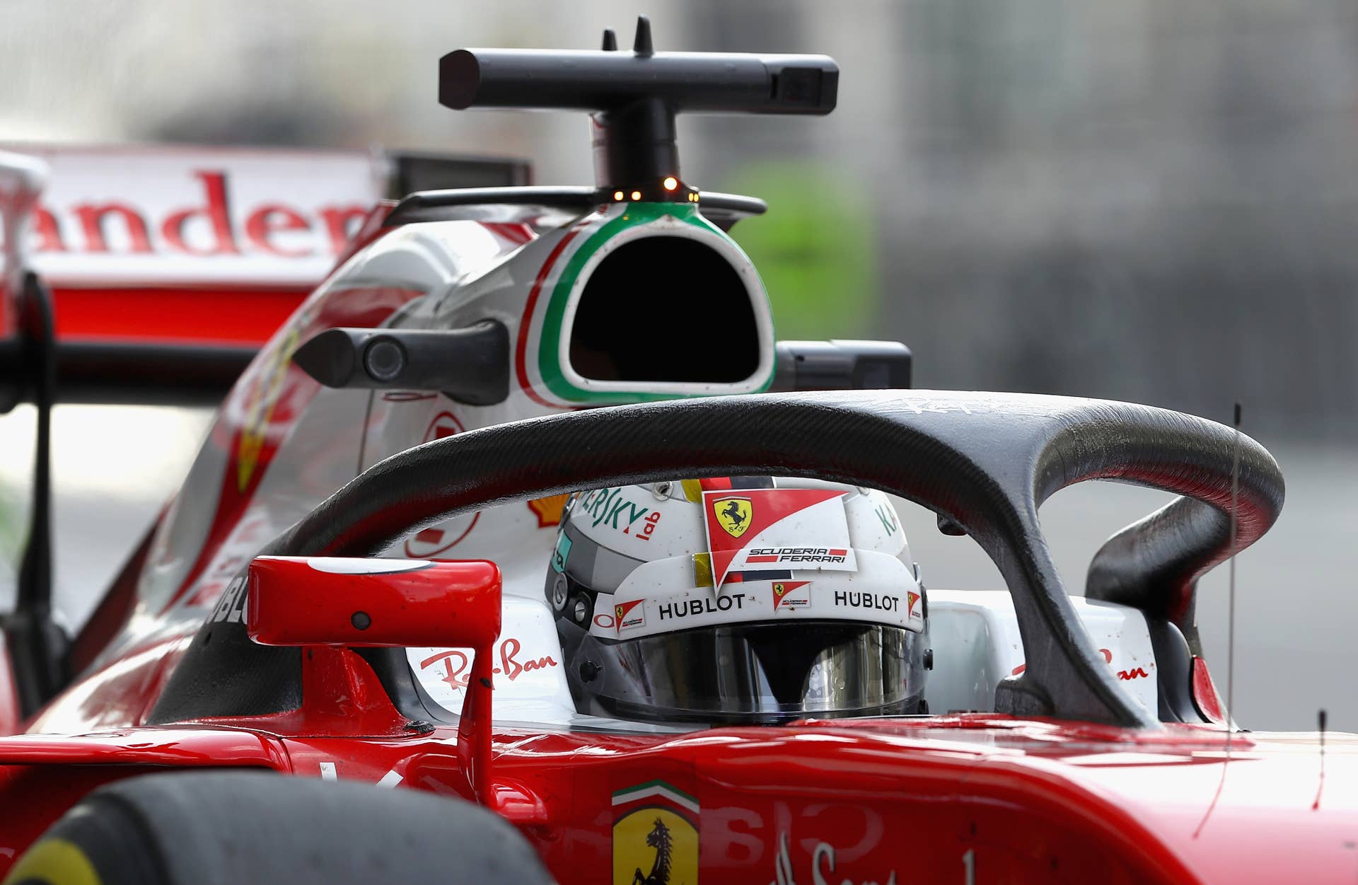 ABU DHABI, UNITED ARAB EMIRATES - NOVEMBER 25: Sebastian Vettel of Germany driving the (5) Scuderia Ferrari SF16-H Ferrari 059/5 turbo (Shell GP) in the Pitlane with the halo fitted during practice for the Abu Dhabi Formula One Grand Prix at Yas Marina Circuit on November 25, 2016 in Abu Dhabi, United Arab Emirates. (Photo by Clive Mason/Getty Images)