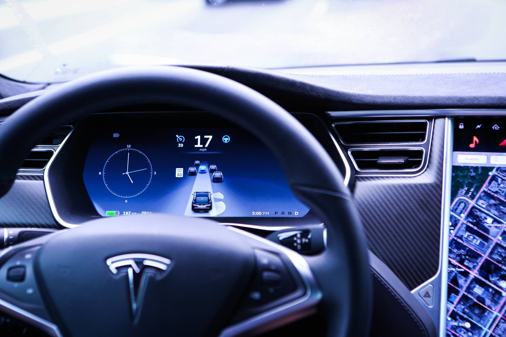 An instrument panel illustrates the road ahead using Autopilot technology just prior to the Tesla Motors Inc. 8.0 software update inside a Model S P90D vehicle in the Brooklyn borough of New York, U.S., on Monday, Sept. 19, 2016. The latest overhaul of the car's operating system, known as Tesla 8.0, biggest change is how Autopilot shifts towards a heavier reliance on its radar than its camera to guide the car through traffic. Photographer: Christopher Goodney/Bloomberg via Getty Images