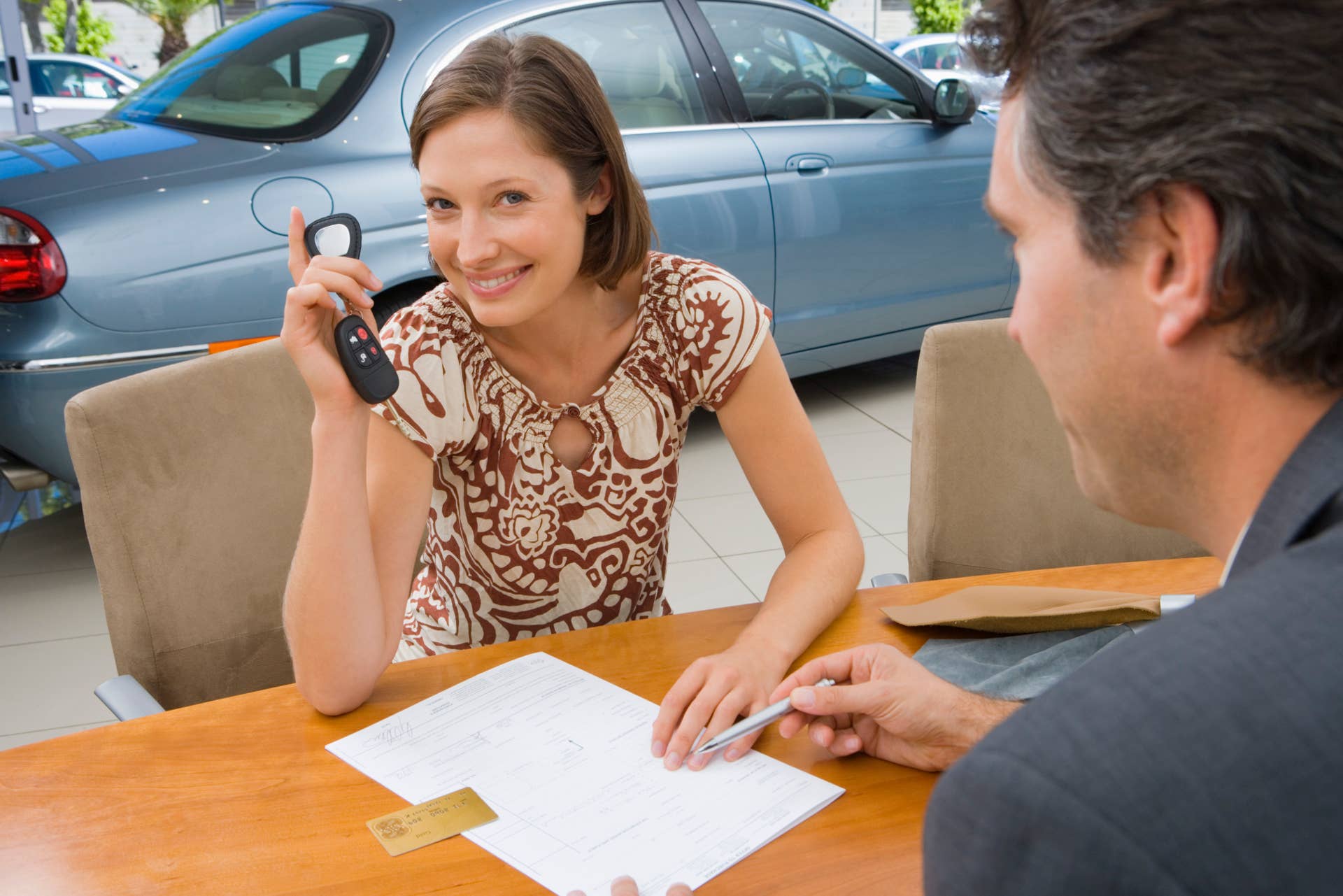 Woman purchasing new car