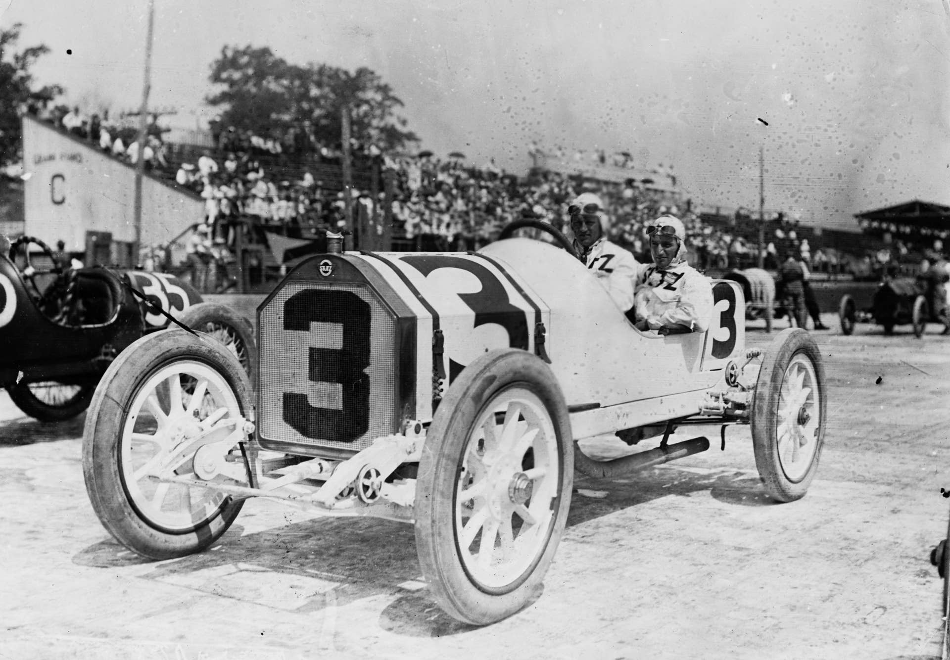 Gil Andersen of Norway with his riding mechanic aboard the #3 Stutz Motor Company Stutz Bearcat racer before the start of the third running of the Indianapolis 500 Mile Race on 30 May 1913 at the Indianapolis Motor Speedway, Speedway, Indianapolis, United States. (Photo by Topical Press/Hulton Archive/Getty Images).