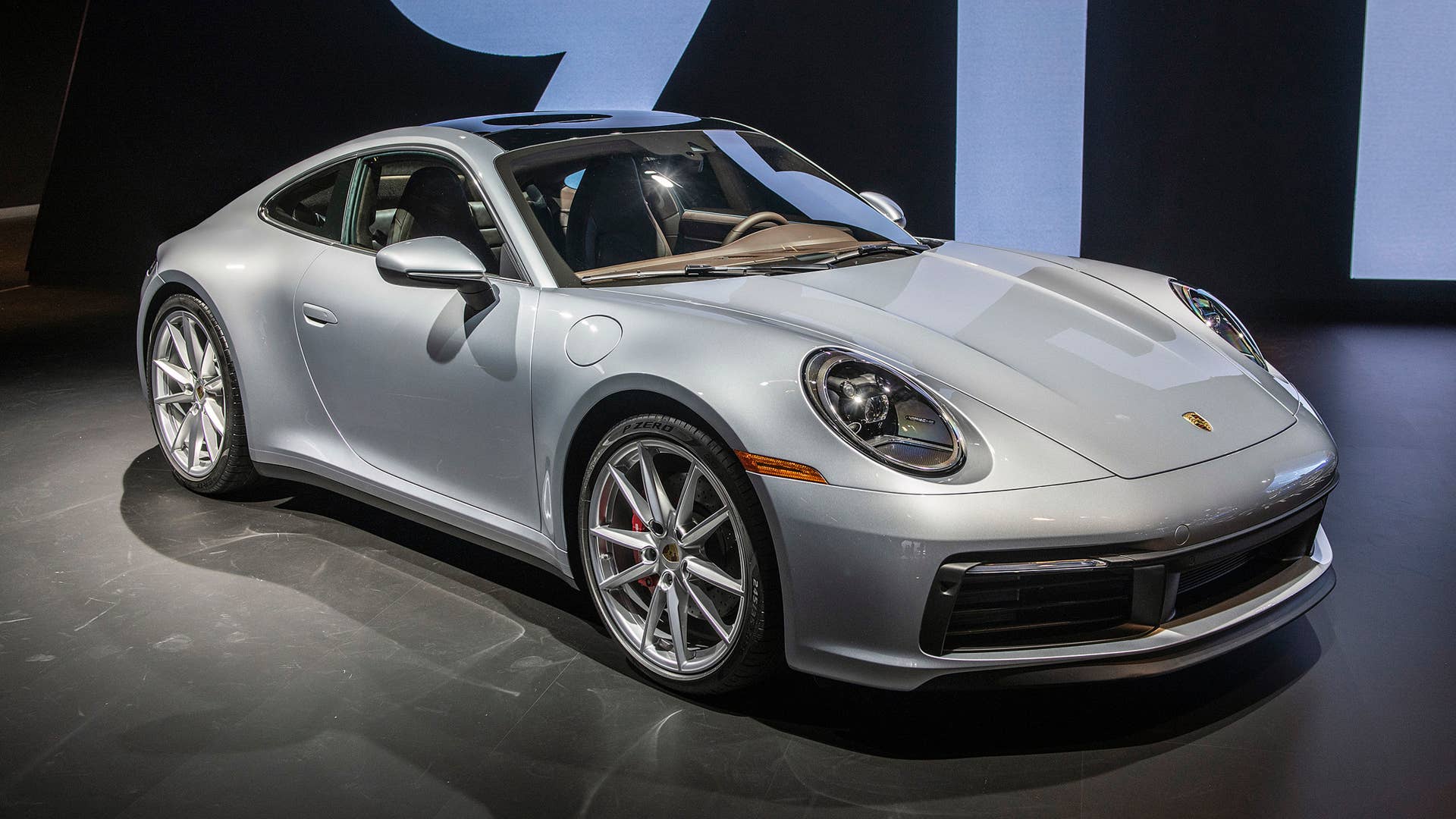 Hybrid and PHEV versions are coming. Here's how Porsche would shoehorn that tech into the 992-generation 911.