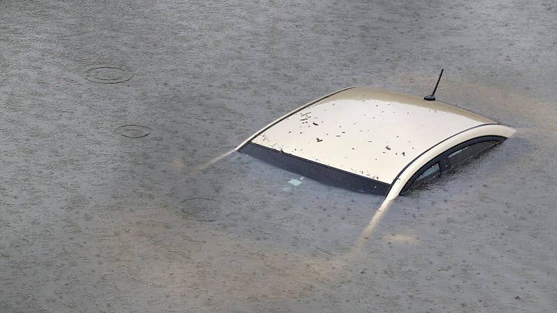 TOPSHOT - A submerged car is seen on Interstate 610 North on August 27, 2017 in Houston as the city battles with tropical storm Harvey and resulting floods. / AFP PHOTO / Thomas B. Shea (Photo credit should read THOMAS B. SHEA/AFP/Getty Images)
