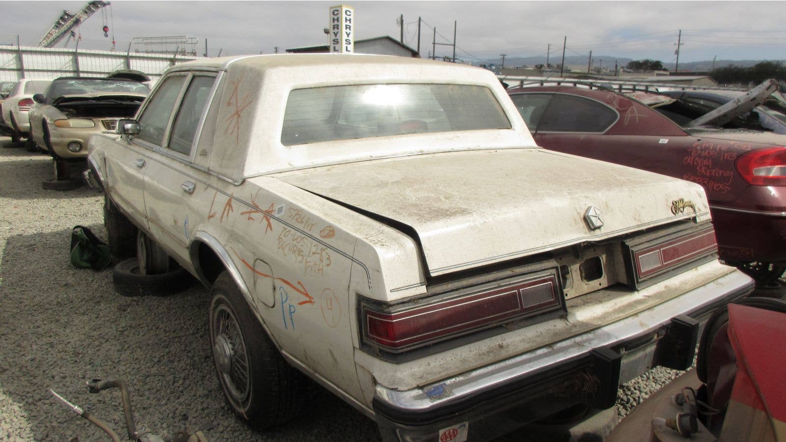 1986 Chrysler Fifth Avenue in California wrecking yard