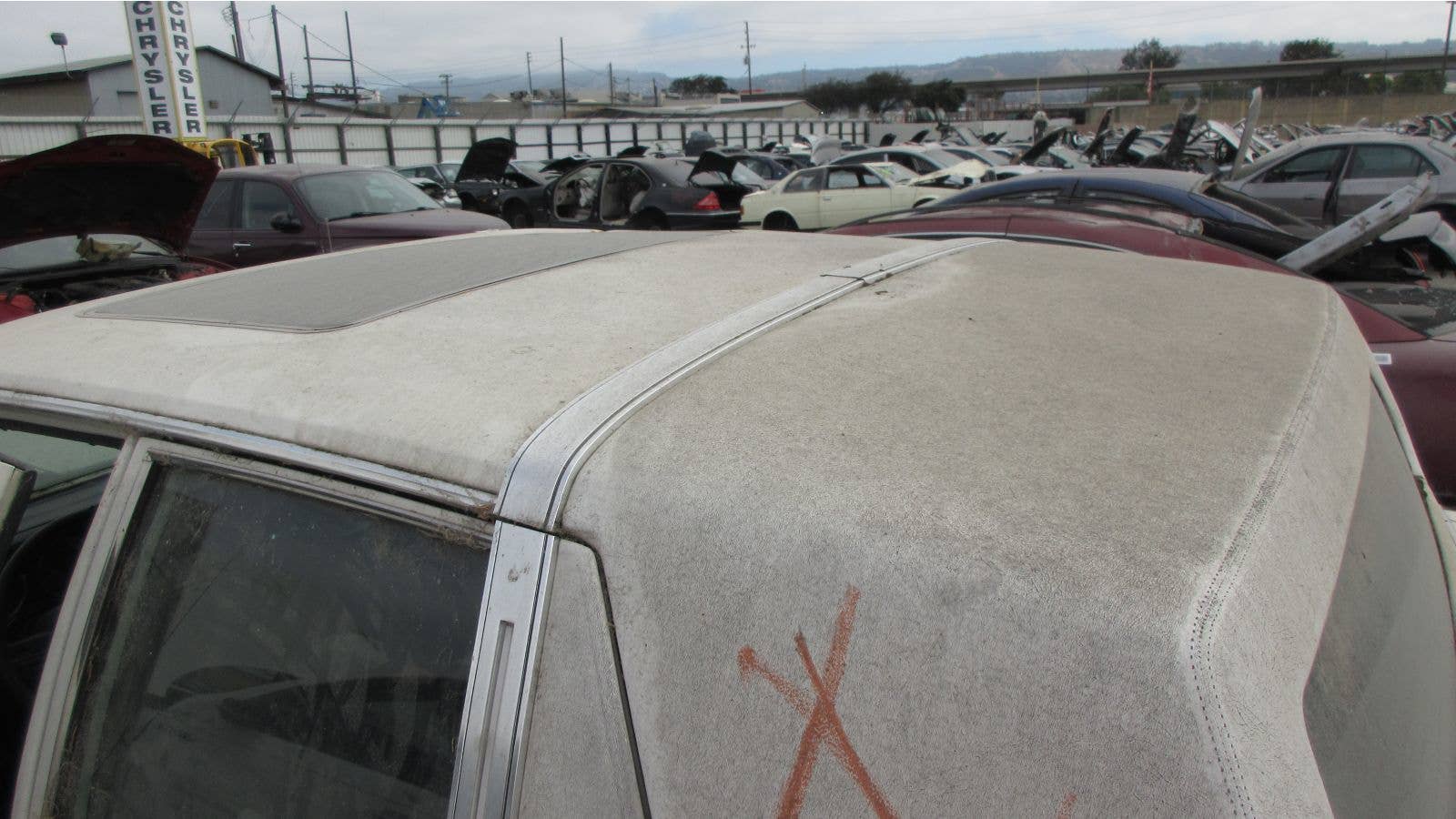 1986 Chrysler Fifth Avenue in California wrecking yard