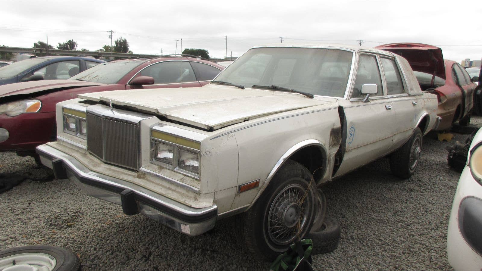 1986 Chrysler Fifth Avenue in California wrecking yard