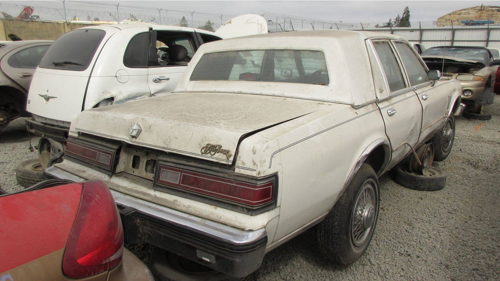 1986 Chrysler Fifth Avenue in California wrecking yard