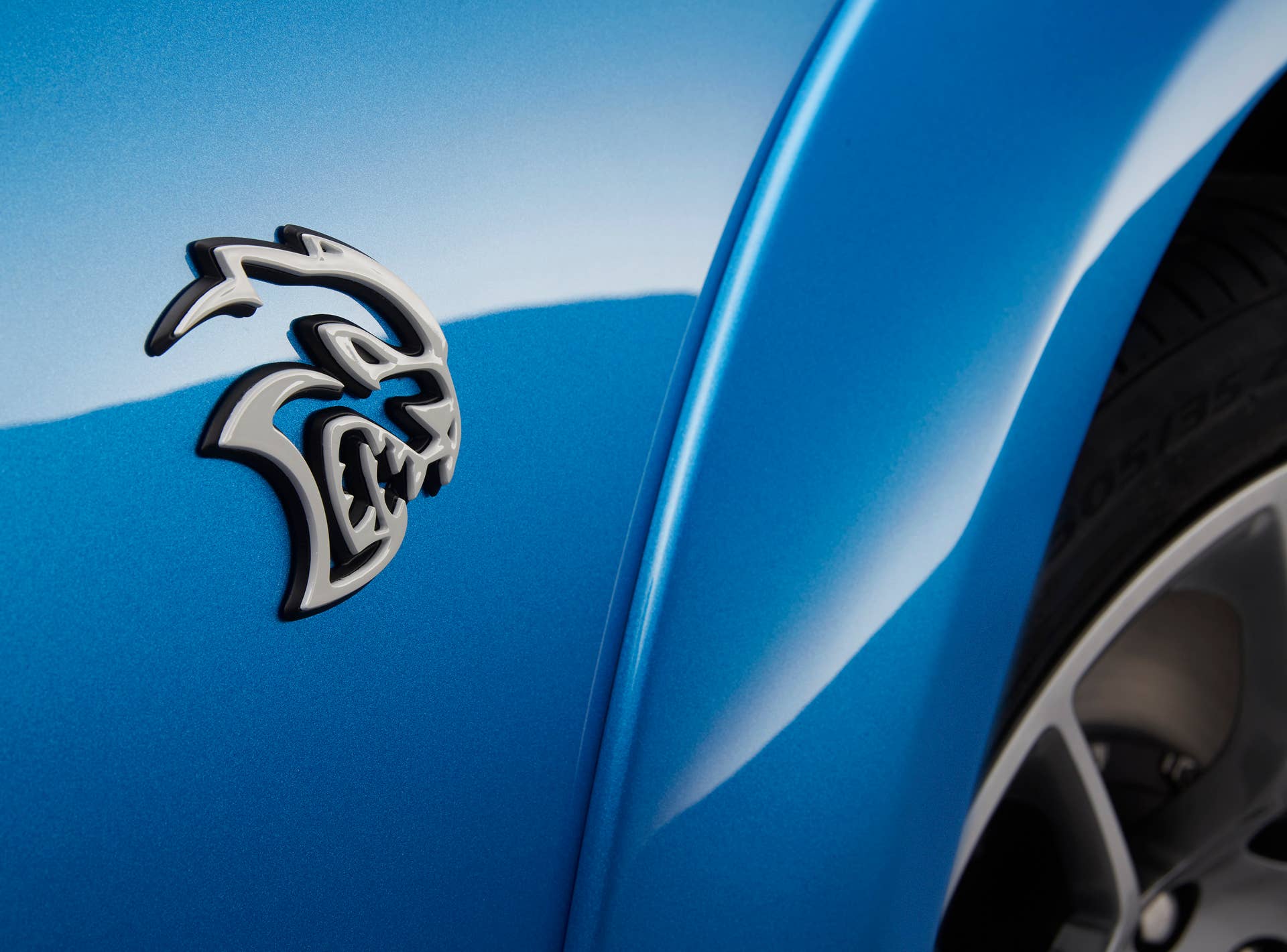 The Hellcat badge on the 2020 Dodge Charger SRT Hellcat Widebody Daytona 50th Anniversary comes in white on B5 Blue, Pitch Black and Triple Nickel models