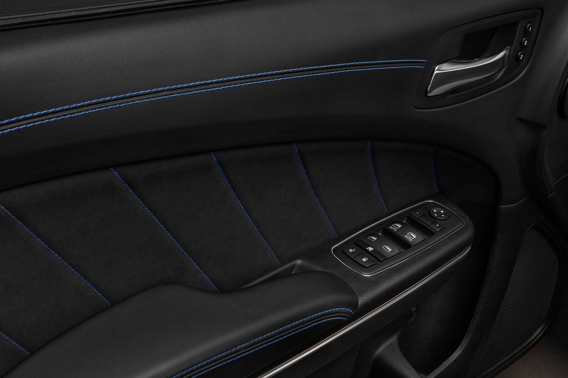 2020 Dodge Charger SRT Hellcat Widebody Daytona 50th Anniversary Edition's race-inspired interior features a blue accent stitch that appears throughout the interior, on the center console armrest, door panels and armrest, dashboard and shifter