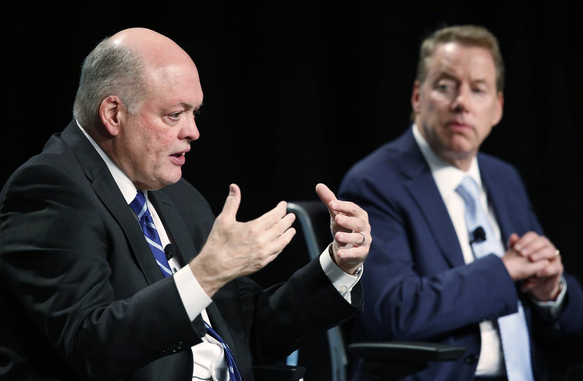 Jim Hackett, incoming chief executive officer of Ford Motor Co., left, speaks as Bill Ford, executive chairman of Ford Motor Co., listens during an event at the company's headquarters in Dearborn, Michigan, U.S., on Tuesday, May 22, 2017. Ford Motor Co.�is replacing embattled chief executive officer�Mark Fields�with�Hackett,�a turnaround specialist who has been leading the automaker's moves into self-driving cars and ride sharing. Photographer: Jeff Kowalsky/Bloomberg via Getty Images