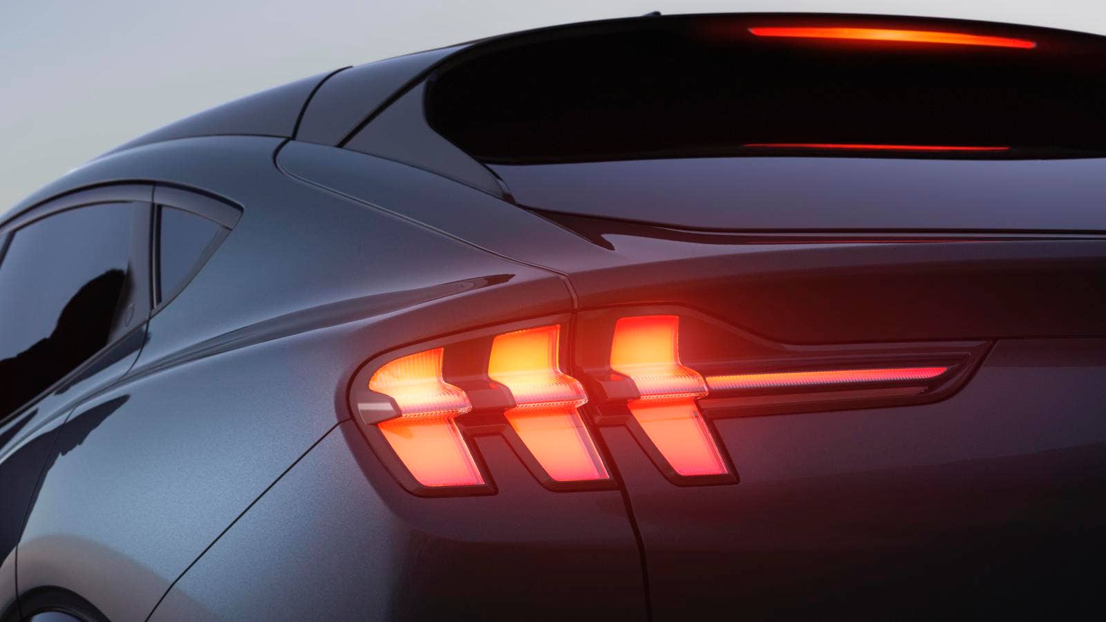 The Mustang Mach-E is instantly recognizable as a Mustang, with designers preserving the Mustang’s rear-haunch design and trademark tri-bar tail lamps, creating larger rear fenders that give the vehicle a wider feel and a more powerful stance