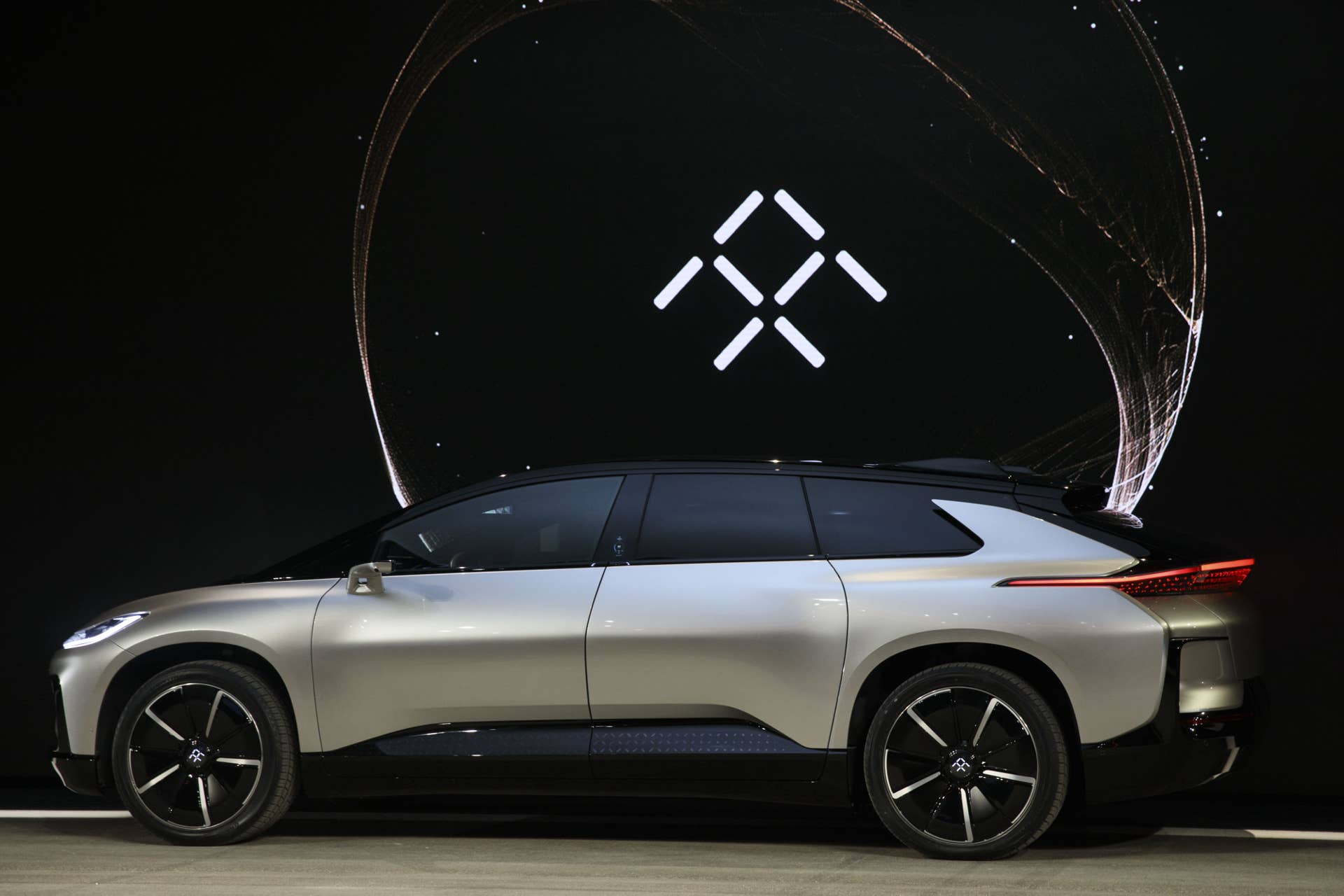 The Faraday Future FF91 electric car is unveiled at the 2017 Consumer Electronics Show (CES) in Las Vegas, Nevada, U.S., on Tuesday, Jan. 3, 2017. Faraday Future staked its claim to the world's fastest electric car with its FF91 production model, showing footage of it outracing Tesla Motors Inc.'s Model S in a glitzy event in Las Vegas. Photographer: Patrick T. Fallon/Bloomberg via Getty Images