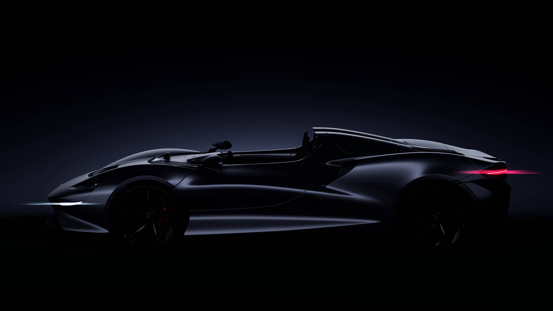McLaren Ultimate Series Roadster in profile in low light