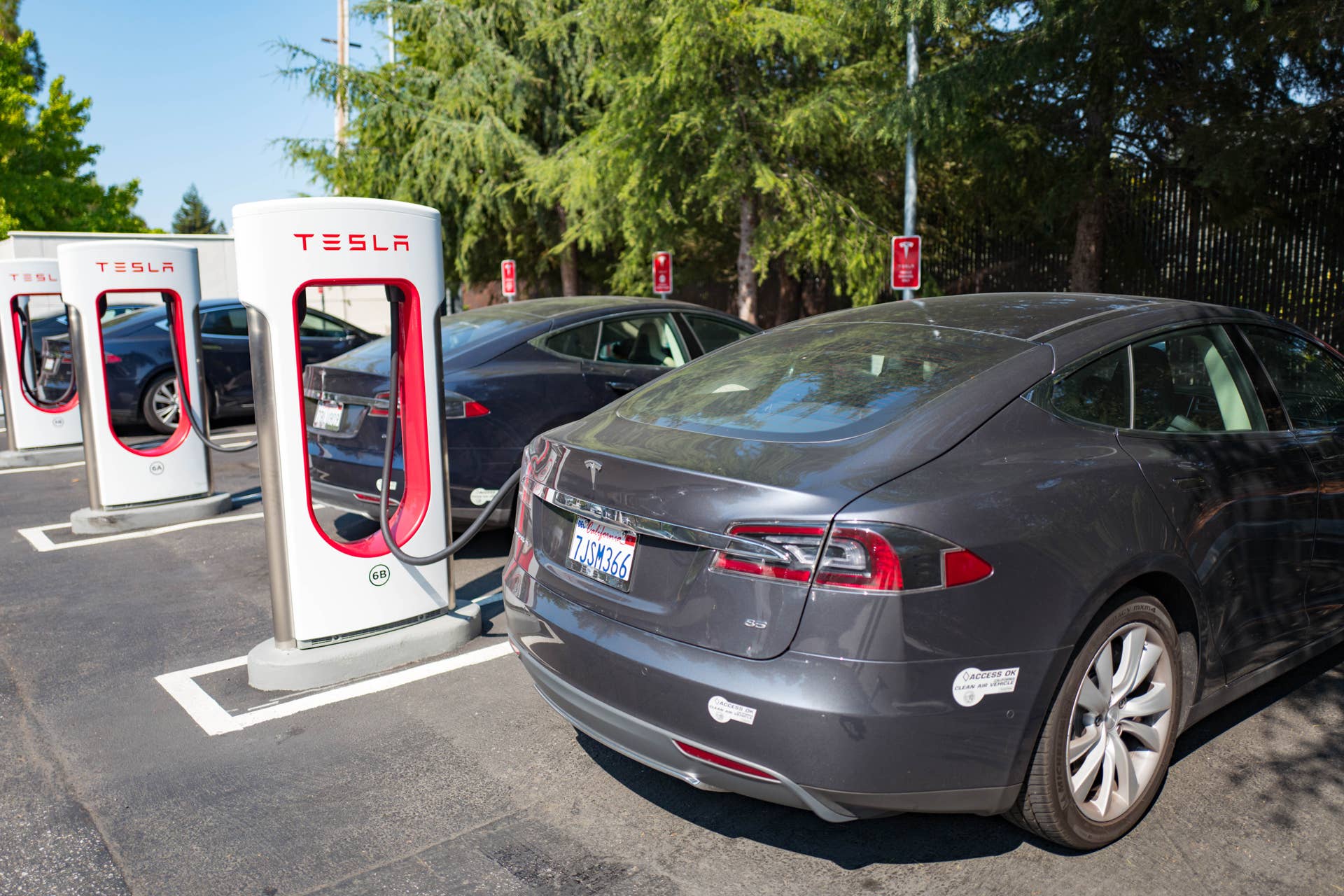 Tesla vehicles plugged in and charging at a Supercharger rapid battery charging station for the electric vehicle company Tesla Motors, in the Silicon Valley town of Mountain View, California, August 24, 2016. (Photo by Smith Collection/Gado/Getty Images).
